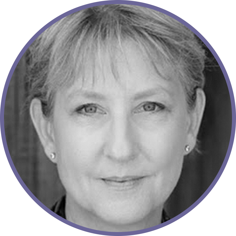 Black and white portrait of a middle-aged woman with short hair and earrings, smiling slightly