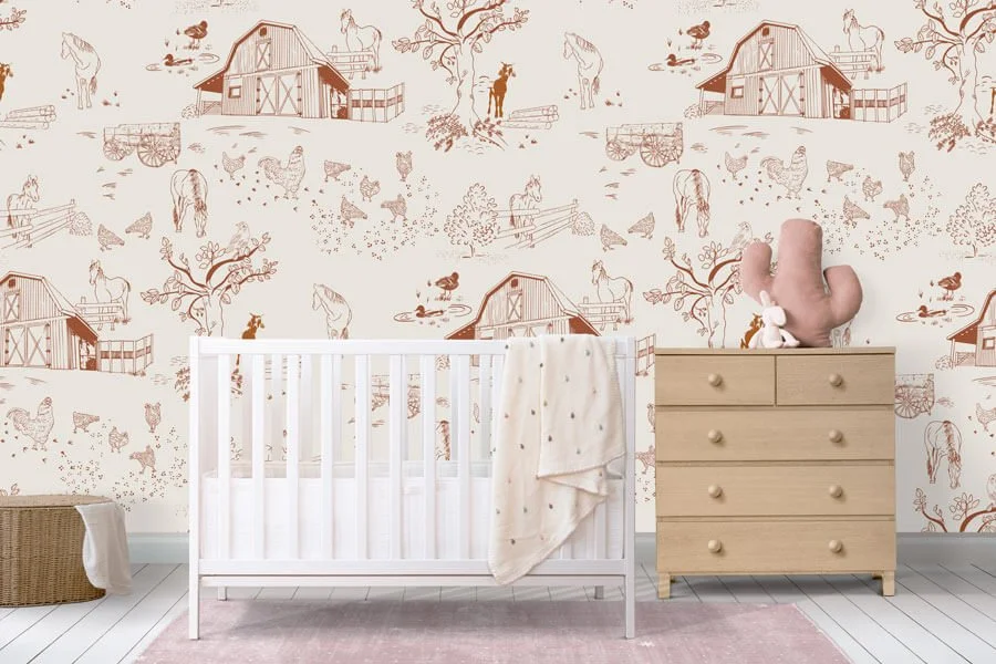 Nursery with farm-themed wallpaper, white crib, and light wood dresser with a baby hand sculpture and stuffed toy.
