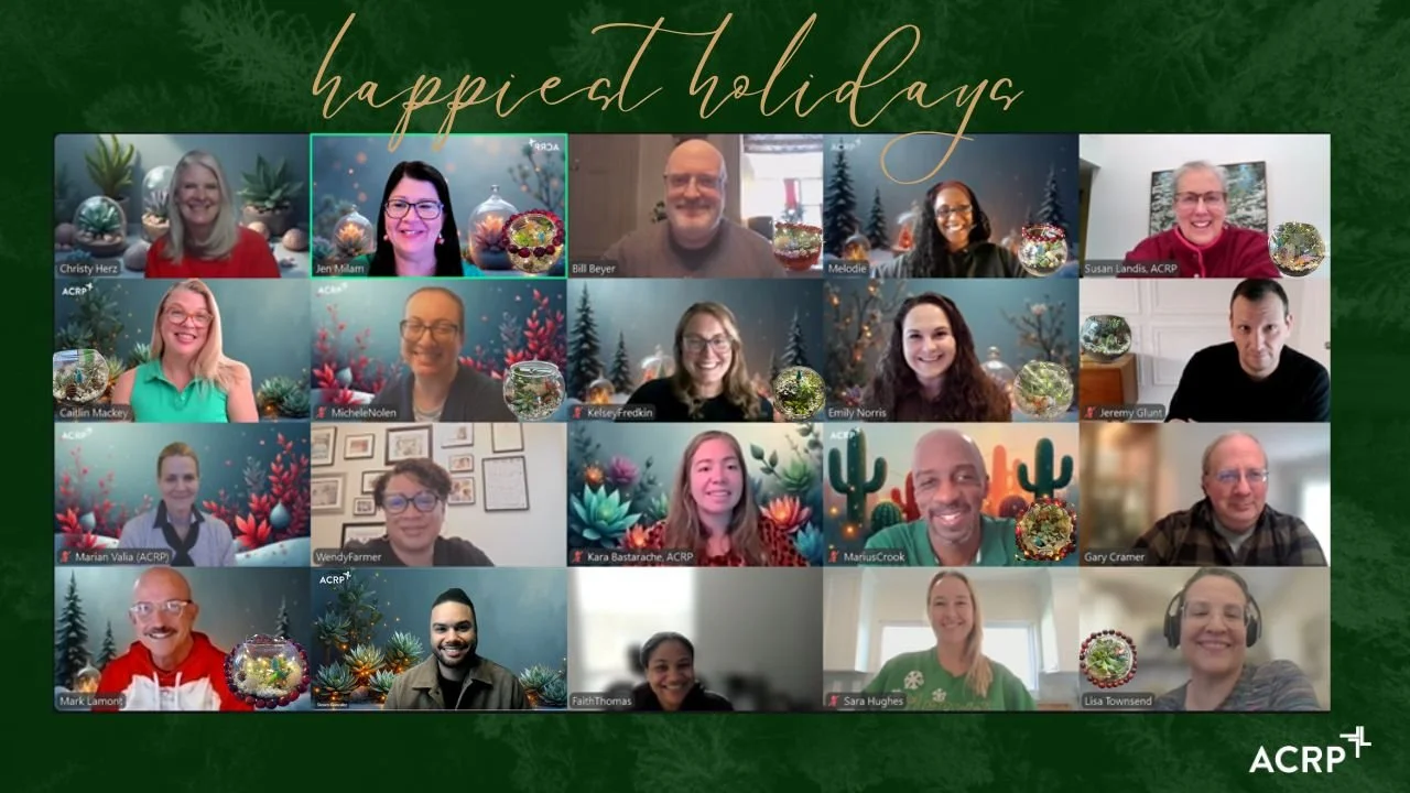 Virtual holiday celebration with 16 smiling people on a video call, some with holiday-themed backgrounds and decorations, and overlay text that reads 'happiest holidays' on a green background.