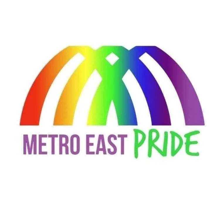 Rainbow-colored arch with the words "METRO EAST PRIDE" below in purple and green text.