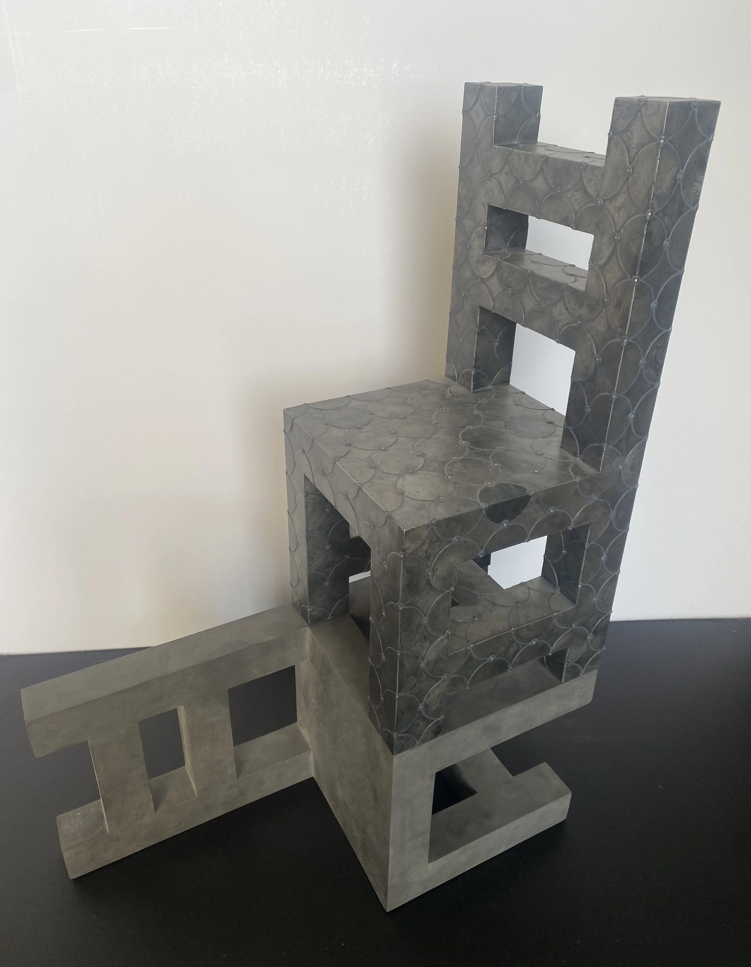 Modern sculptural chair made of metal, with a geometric, abstract design featuring a ladder-like backrest and armrests.