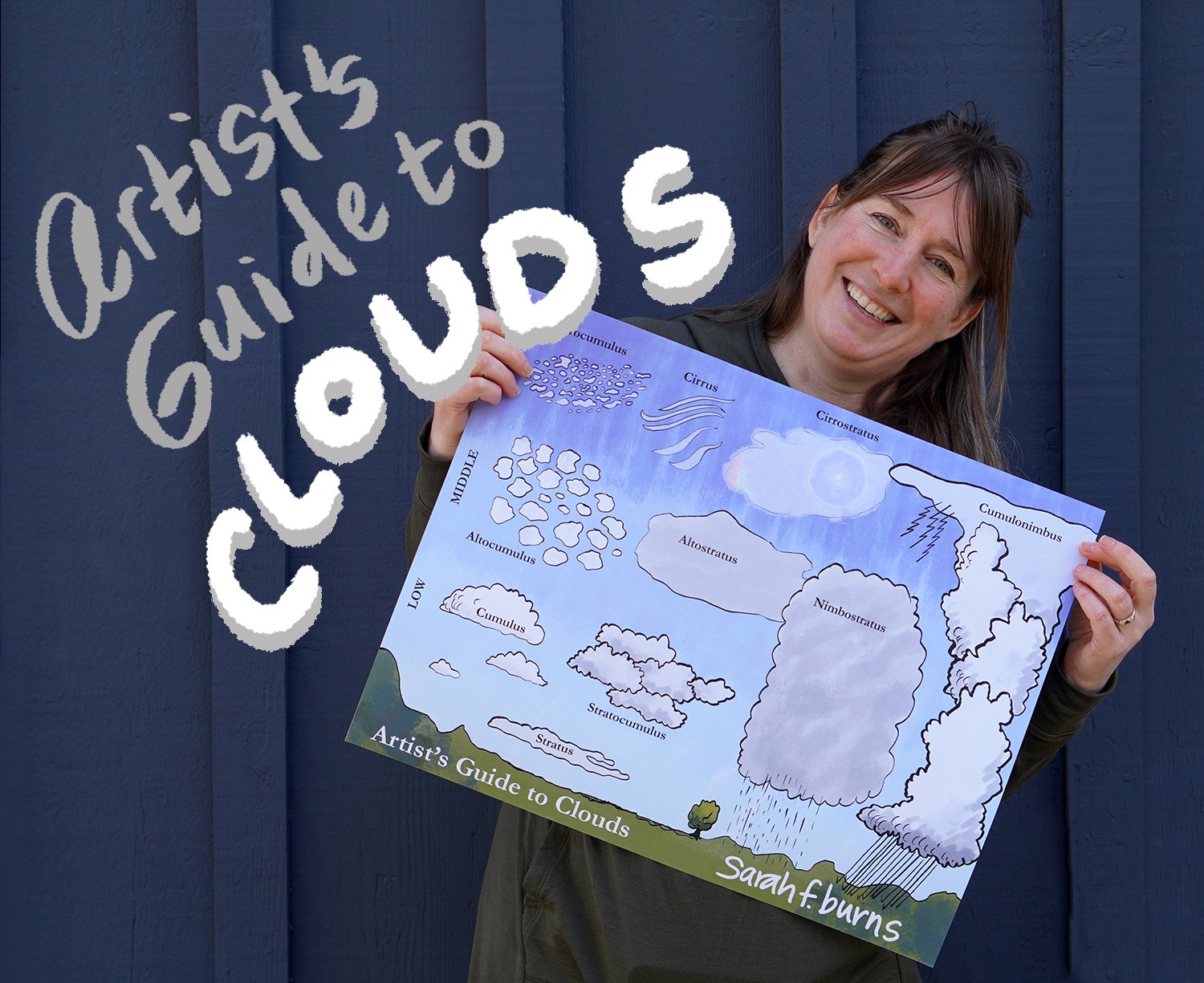 Artist Sarah Burns stands smiling with her cloud guide.