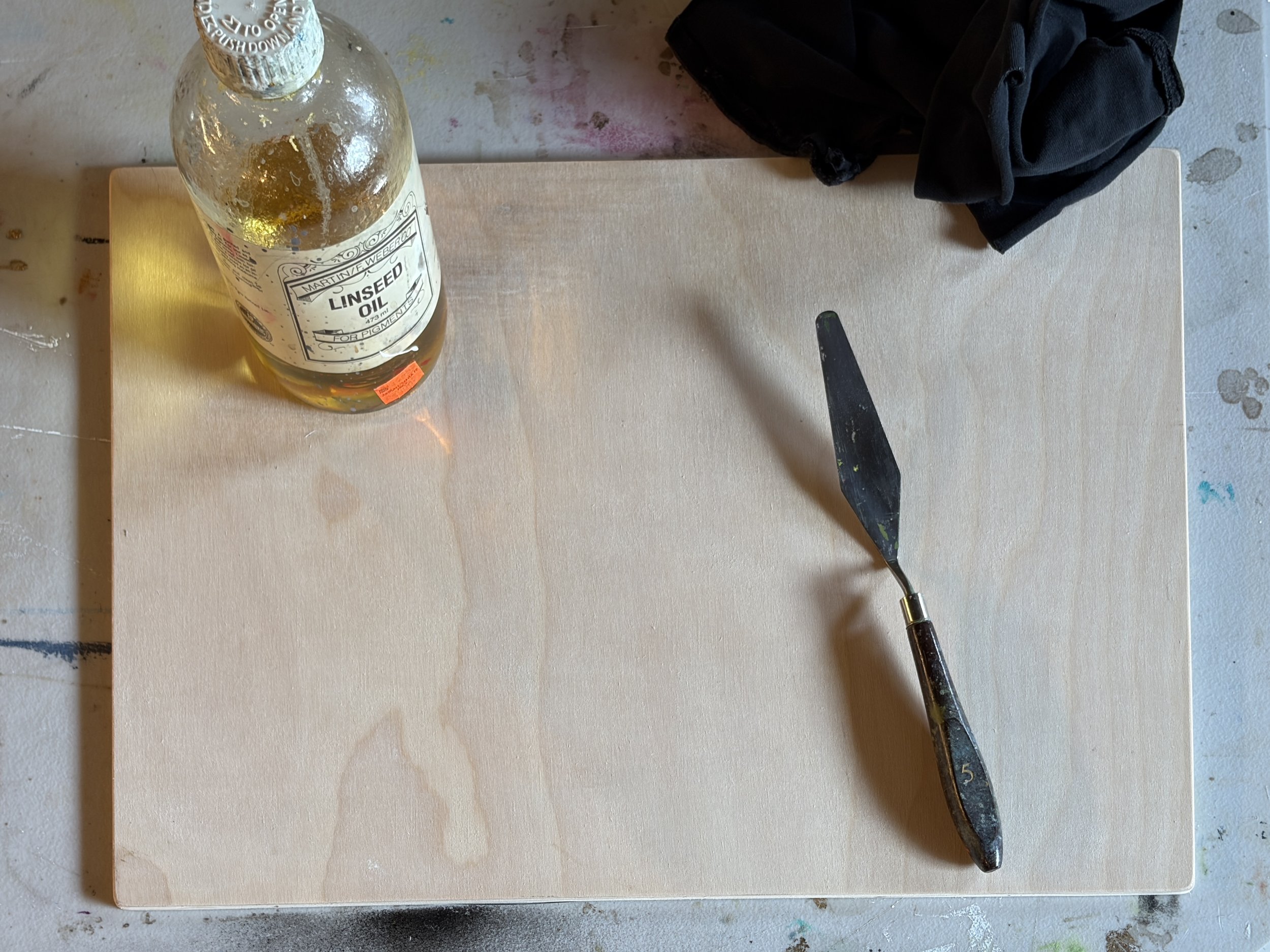 Gather  linseed oil, palette knife and a rag.