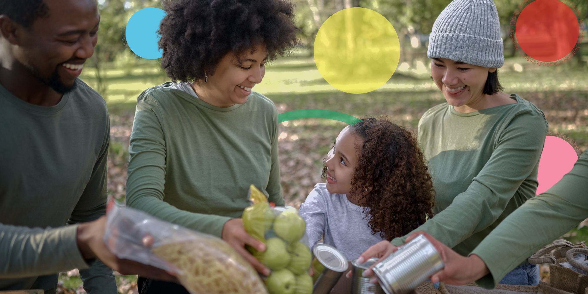 A group of people outdoors exchanging groceries and smiling at a young girl with curly hair, surrounded by trees in a park on a sunny day.