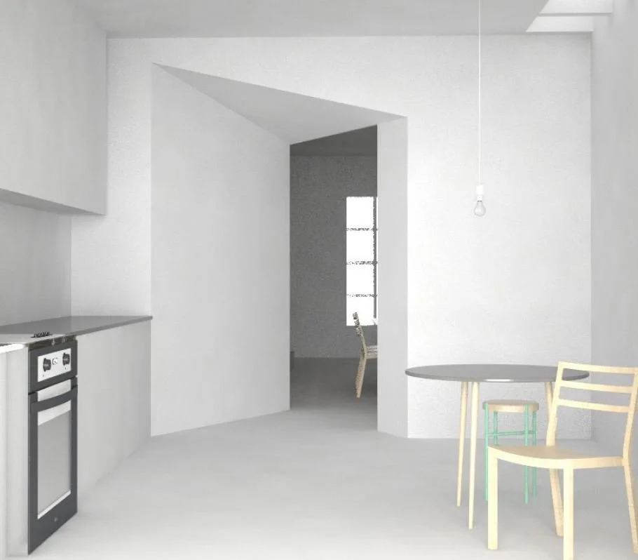 Minimalist kitchen with white walls, a small round table, a chair, and a visible window in the background.