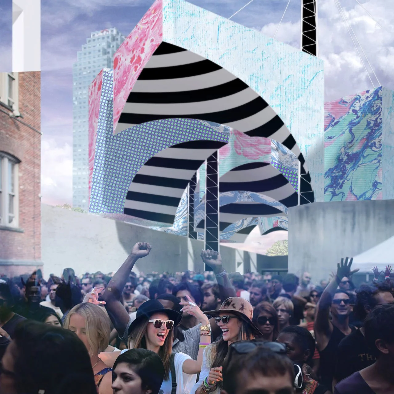 Crowd of people enjoying a music festival outdoors with large, colorful, abstract geometric structures and a blue sky with clouds in the background.