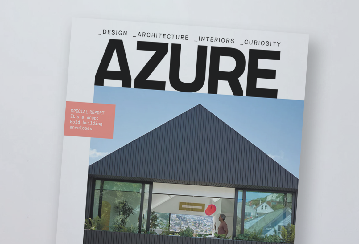 Magazine cover titled Azure with a photo of a modern building with a black, sloped roof and large windows, a woman standing inside, and a view of a cityscape in the background.