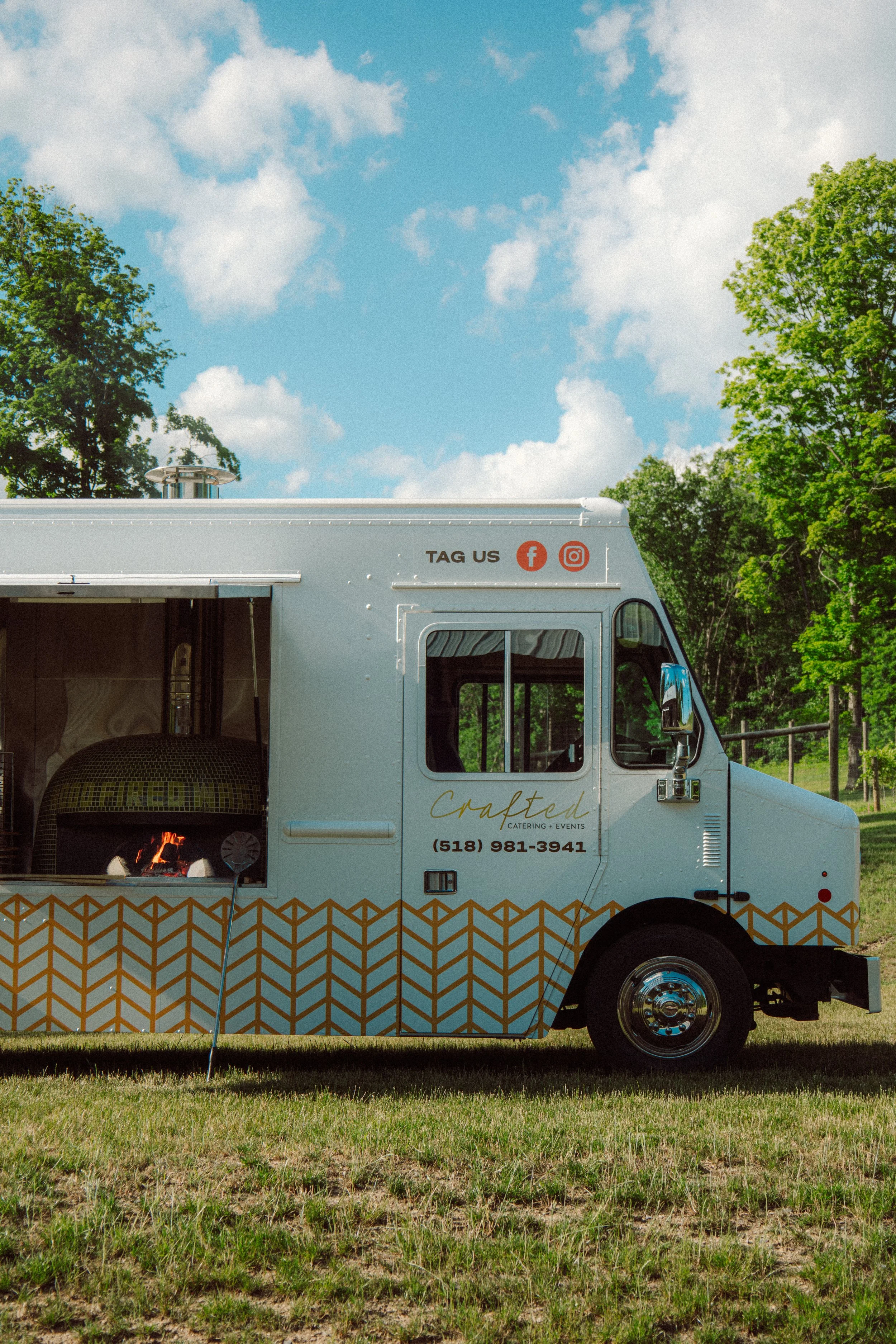 Wood Fired Wagon a mobile catering food truck by crafted catering and events, serving authentic wood fired farm to table pizzas and other food. We cater weddings, birthdays, rehearsal dinner, and so much more!
