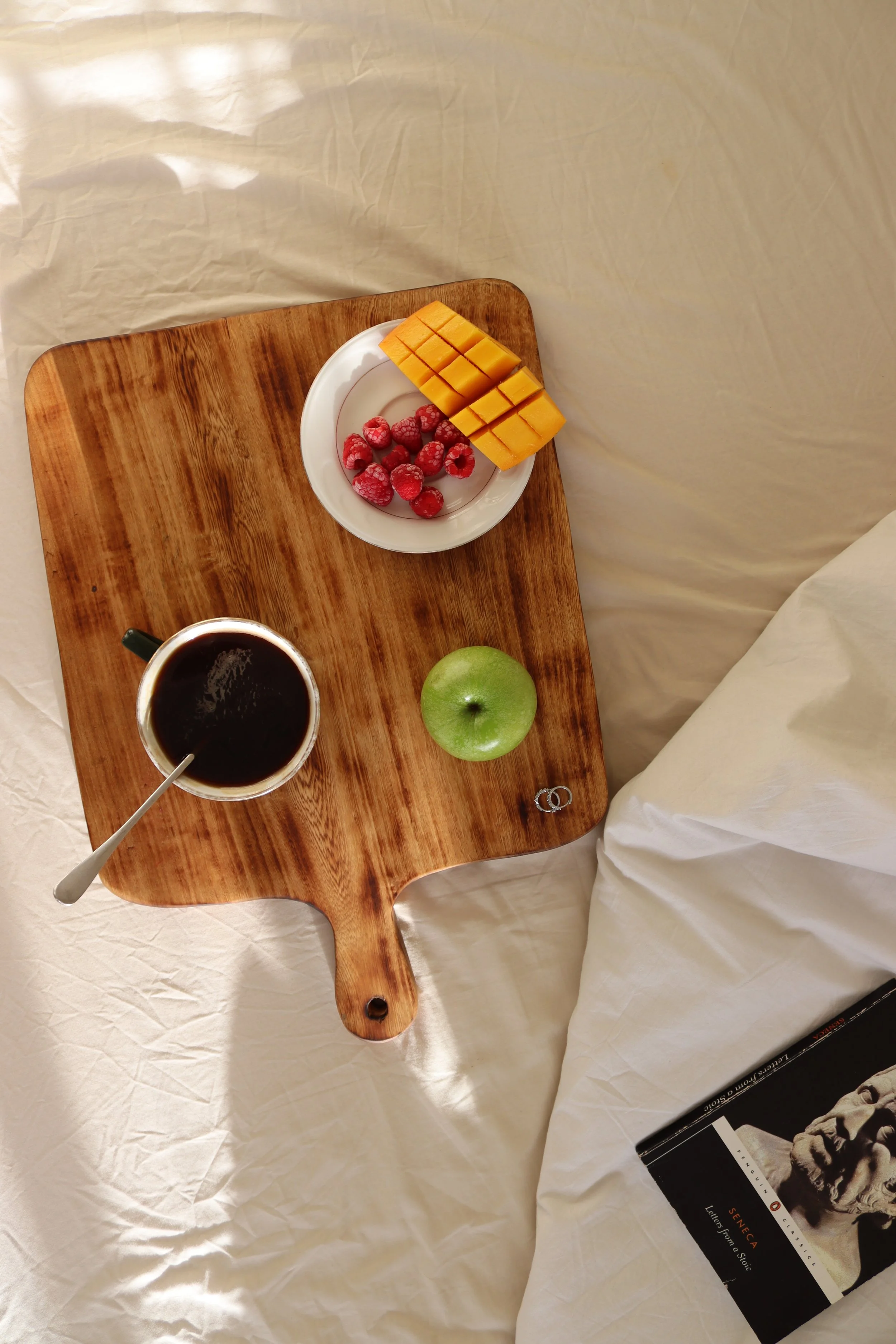 A cutting board made in collaboration with wood artisans in Nairobi, Kenya.