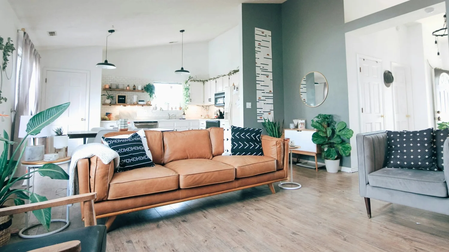 Light-filled living room and kitchen with natural wood accents.