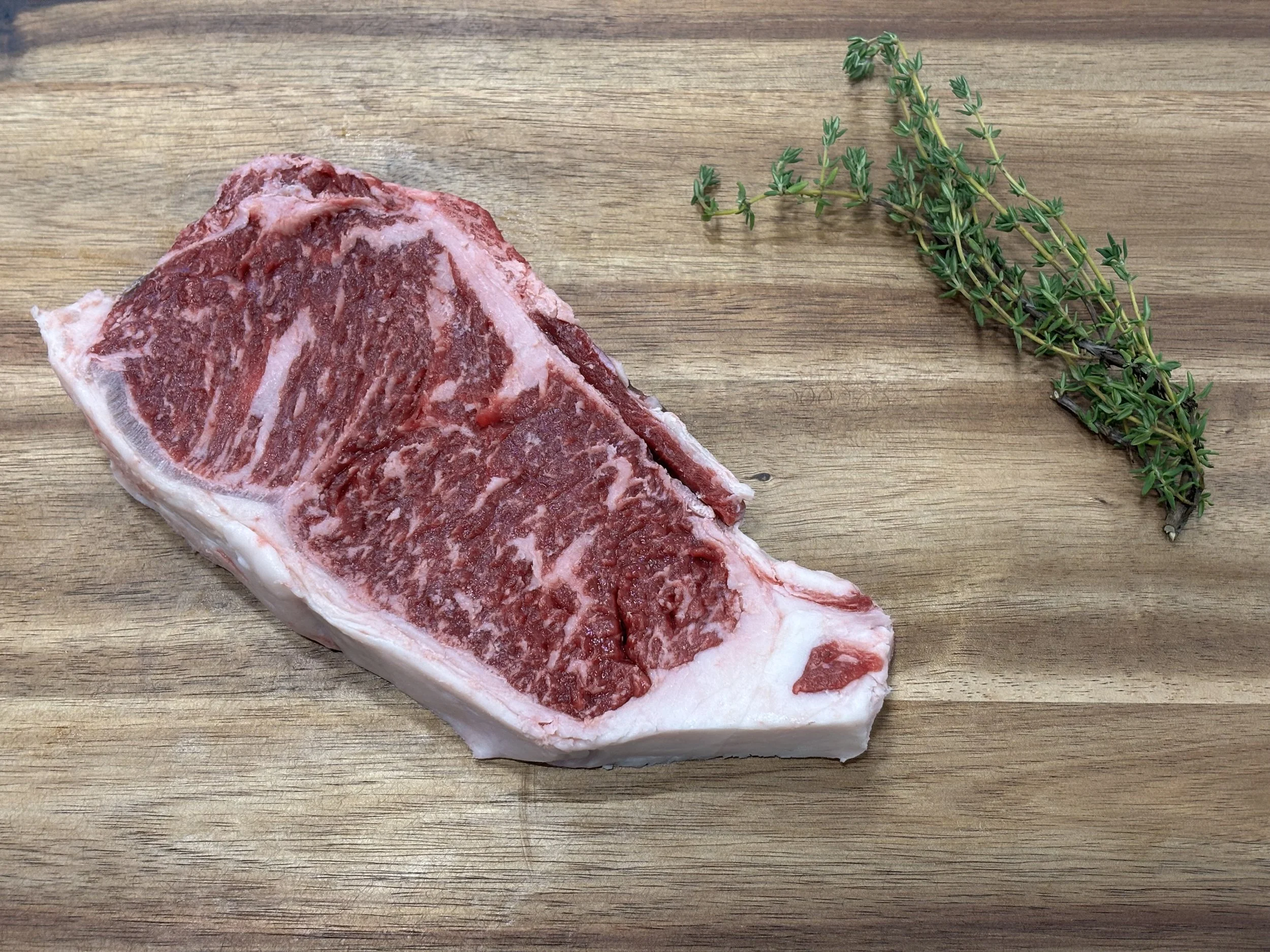Dry Aged New York Strip w/bone 16 oz
