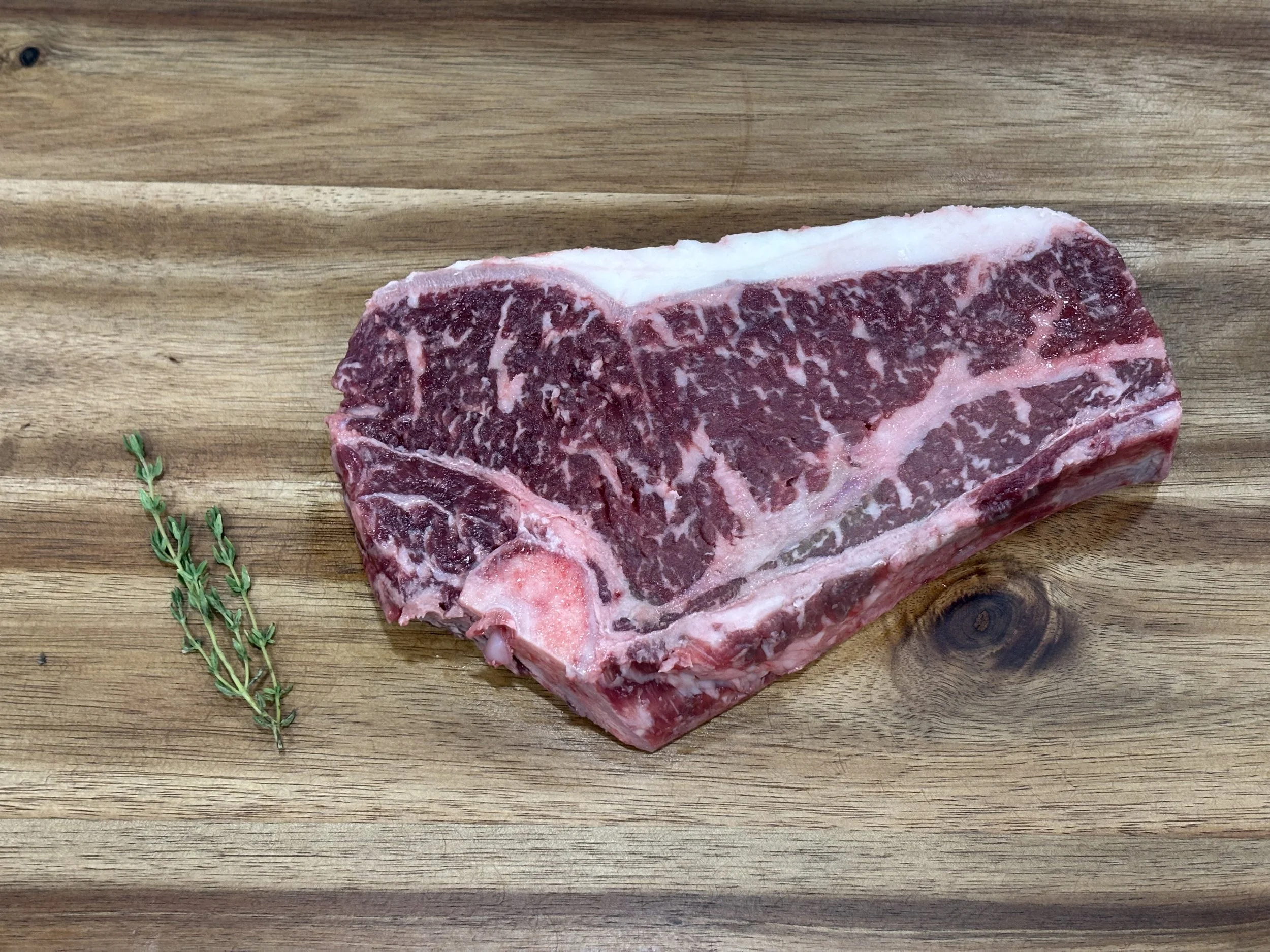 Dry Aged New York Strip w/bone 16 oz