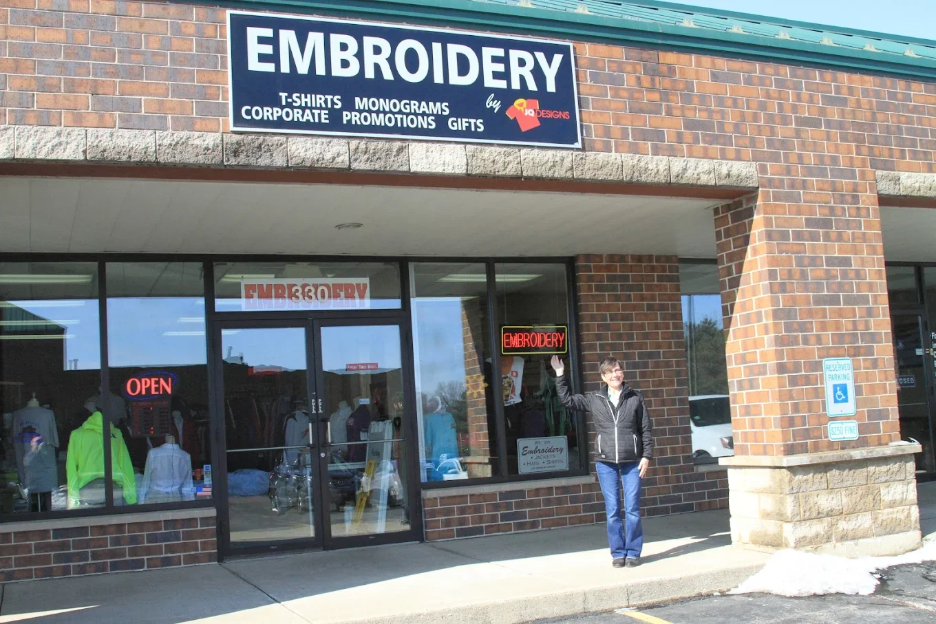 Janet Aldred, owner of JQ Promo, standing outside the JQ Promo storefront in South Elgin, Illinois.