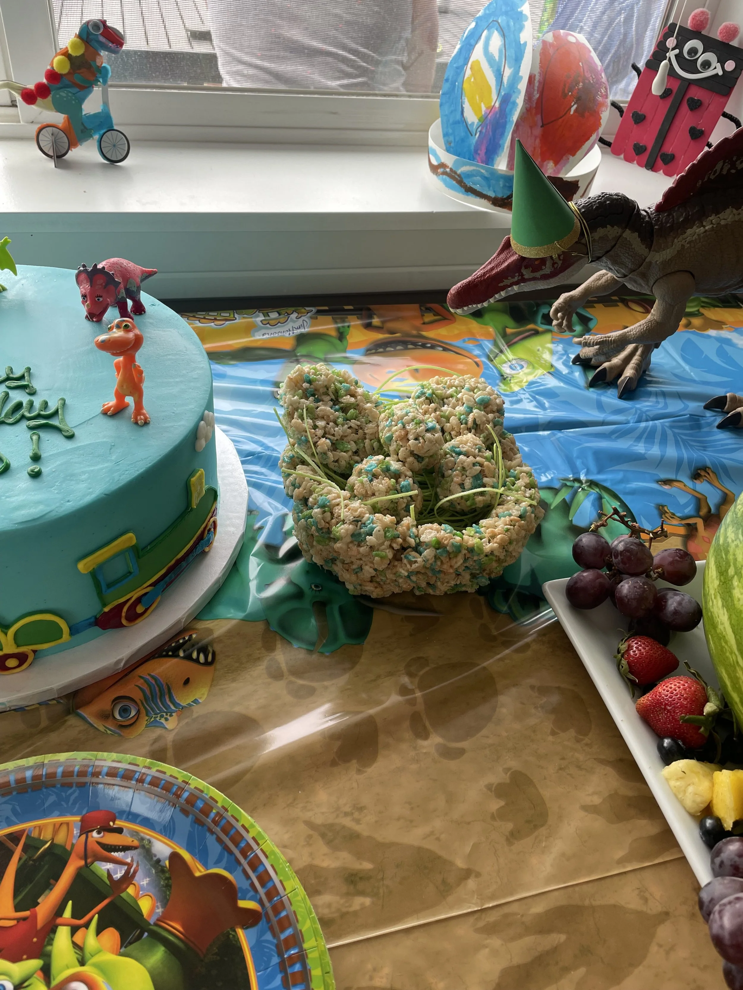 Dinosaur birthday party decor ideas - rice krispie treat dinosaur eggs, dinosaur train cake