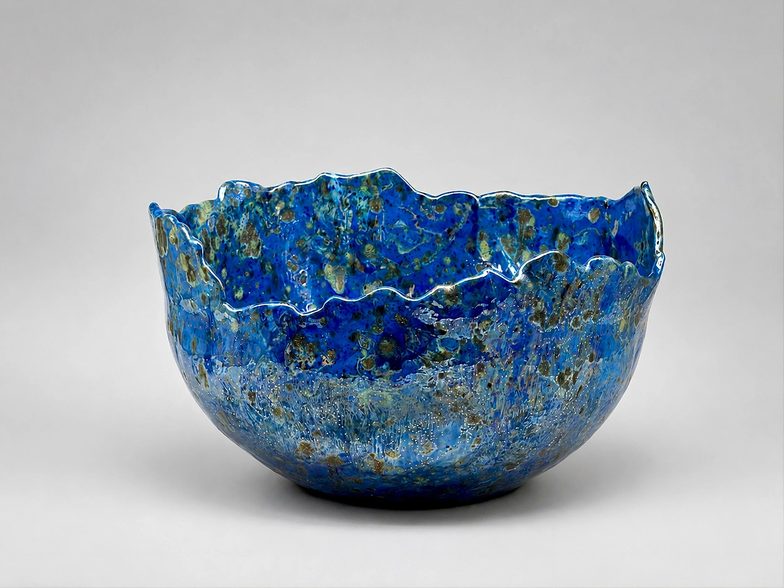 * Title: uNtItLeD_XIIII, @2024
* Medium: Sio-2 Blue porcelain, stoneware, crystal glaze, Mother of Pearl luster glaze
* Size: 8.5" x 13" x 13"