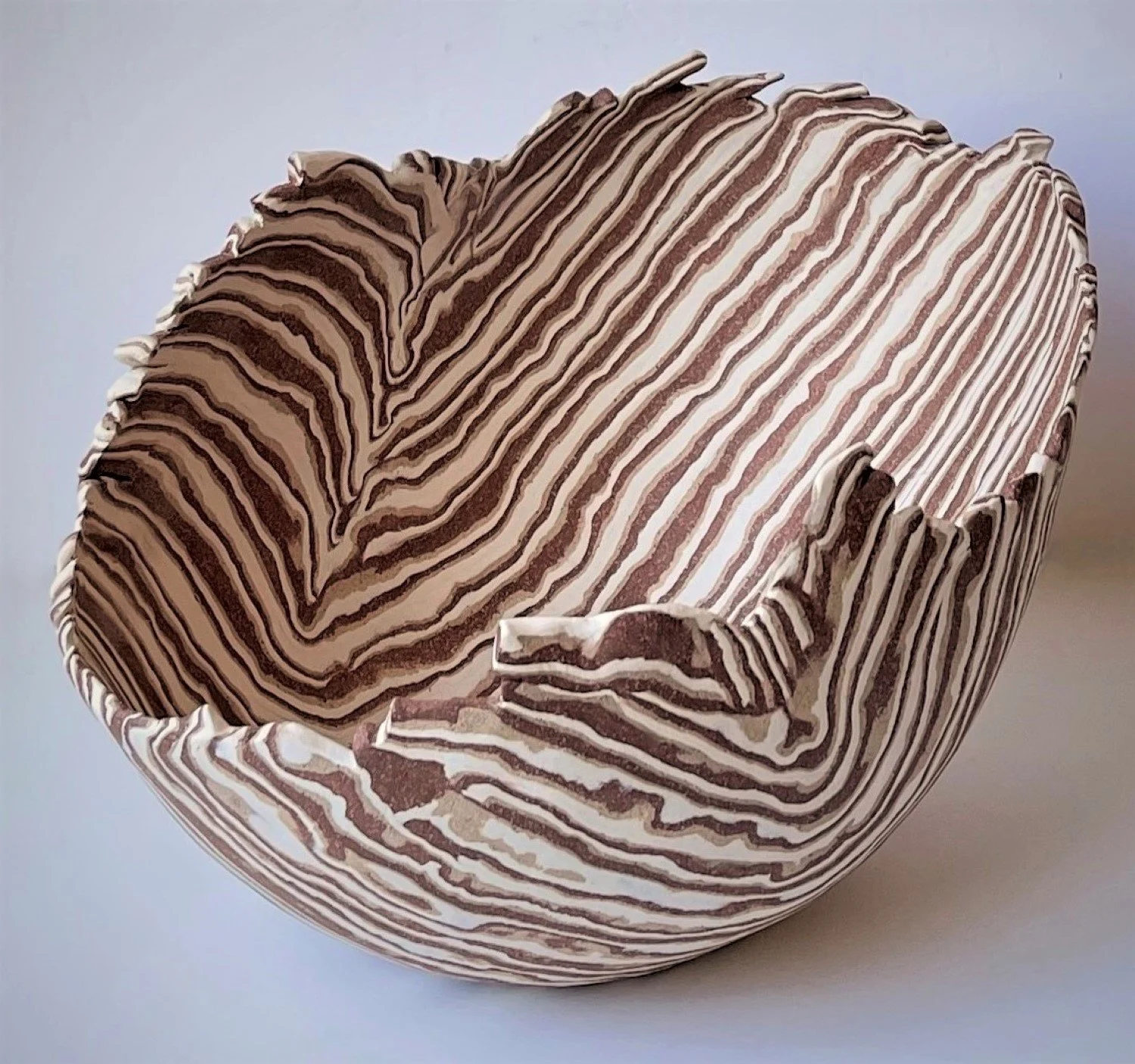 * Title: uNtItLeD_VI, 2022
* Medium: Layered clay with Porcelain, Stoneware, Earthenware
* Size: 7" x 15" x 5"