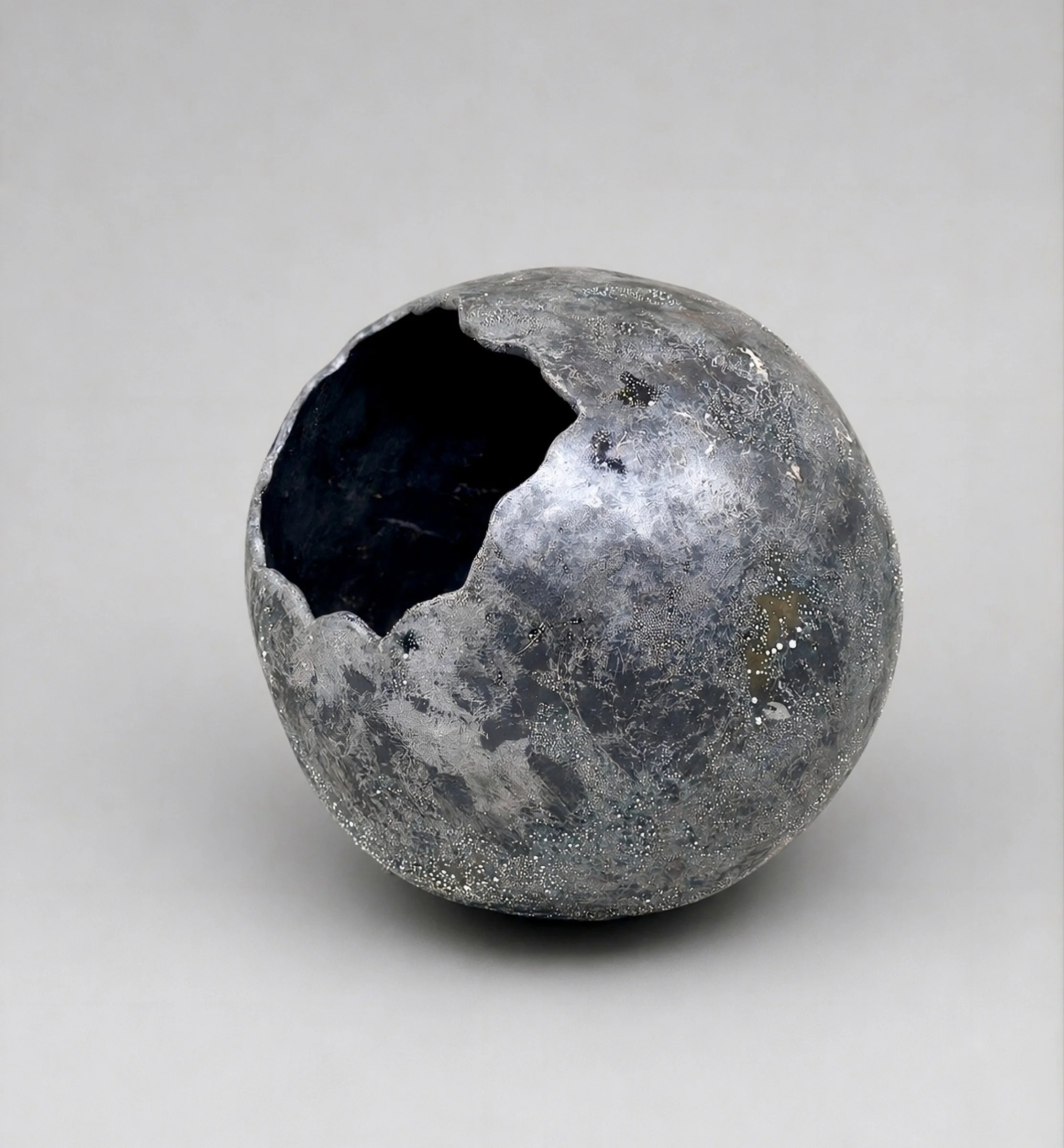 * Title: In_Becoming :: Holding Absence, @2026  * Medium: Azabache LC 3, pigments, Stonewares, silver luster overglaze  * Size: 9" x 7" x 8"