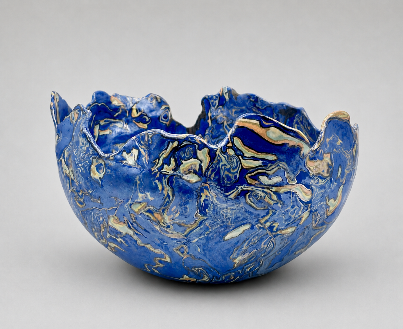 * Title: uNtItLeD_XII.L.2, @2024 * Medium: Sio-2 blue porcelain, 213 porcelain, color pigments, stoneware, Mother of Pearl luster overglaze * Size: 10" x 11" x 8" * This work is no longer available. Image included for portfolio documentation only.