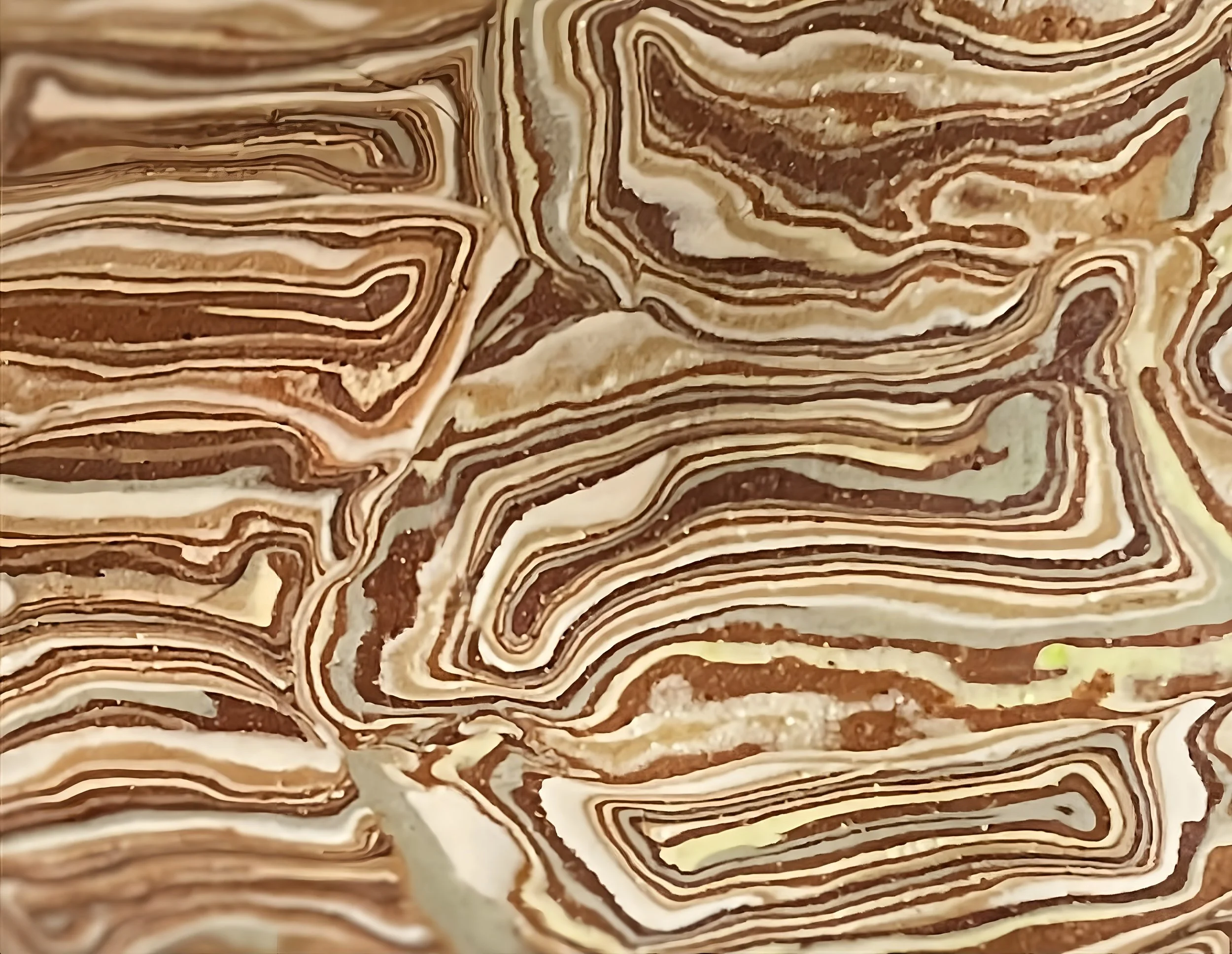 Close-up of a cake with marble-like swirls of chocolate and vanilla.