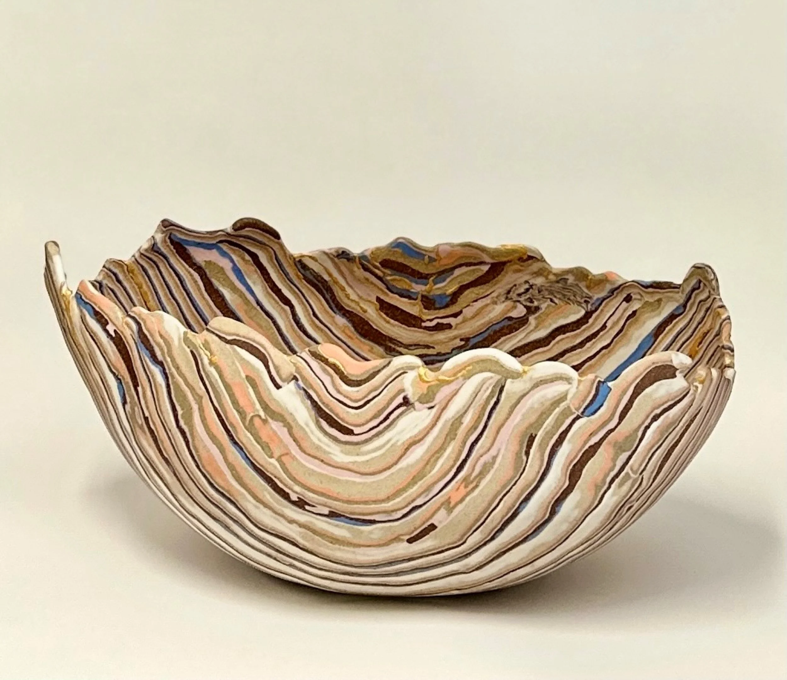* Title: uNtItLeD_VII, @2023
* Medium:  Porcelain, blue, orange, and pink pigments, stonewares, Brooklyn red clay, mica powder mixed with food-safe resin, alternative gold powder and 23.4% real gold powder.
* Size : 9" x 8" x 16" * This work is no lo