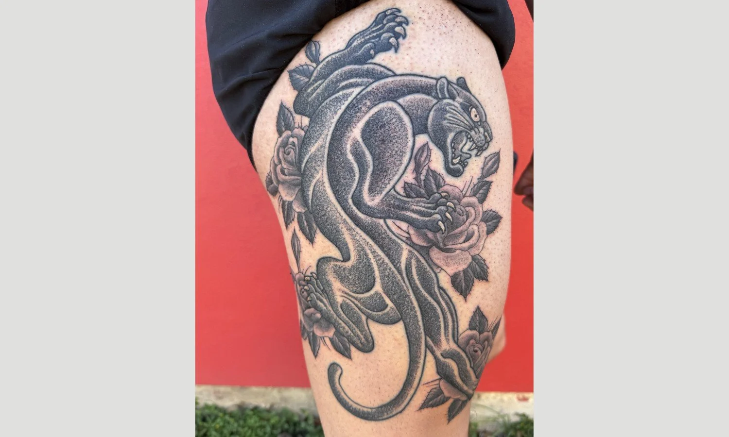 Bold blackwork panther tattoo on thigh with strong lines and shading designed for long-lasting clarity in San Antonio.
