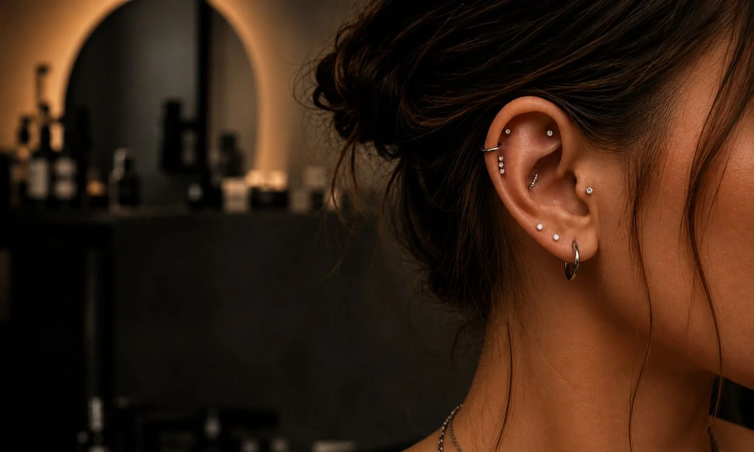 Curated ear piercing collection featuring lobe, helix, and cartilage piercings with implant-grade jewelry.