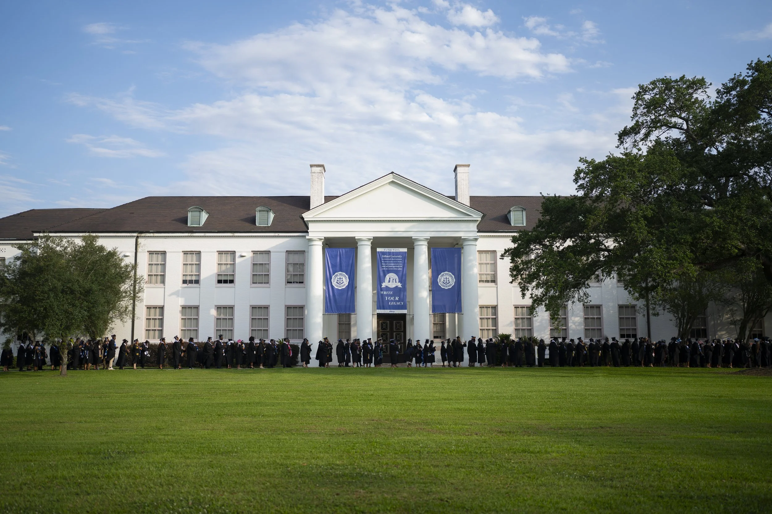 The graduating class gathers and processes before commencement, continuing a tradition rooted in campus history.