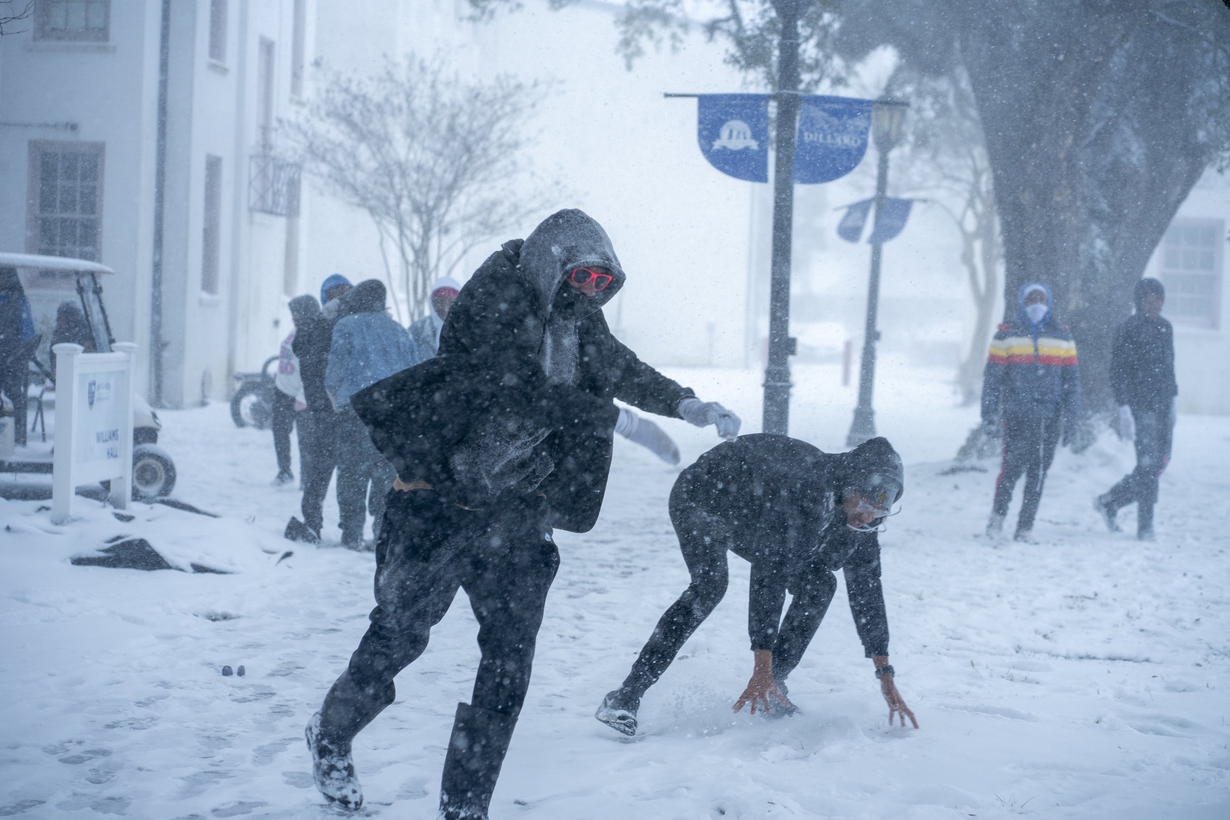 During a once-in-a-generation winter storm, students gather outside to experience snowfall many were seeing for the first time.