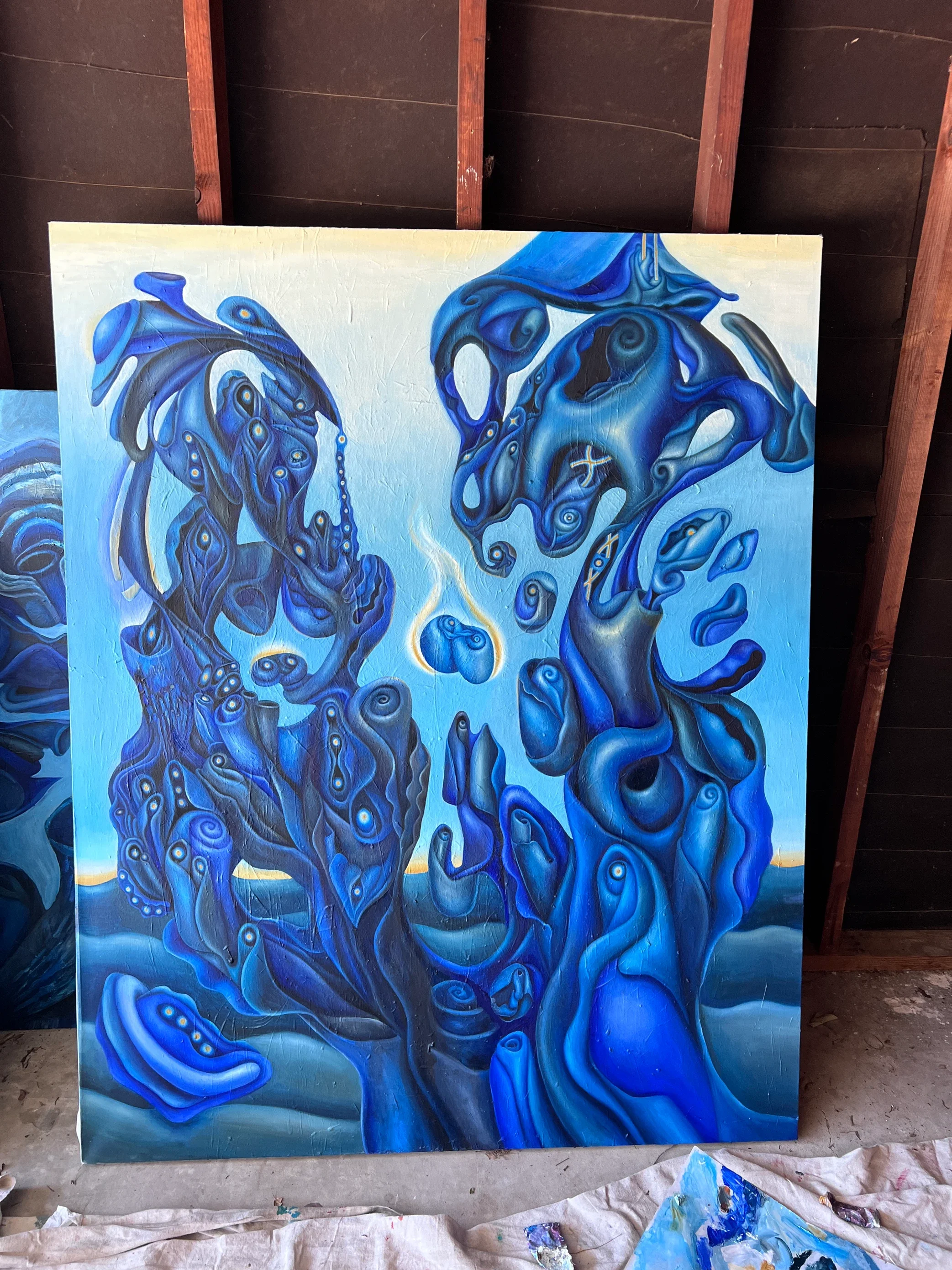 blue painting of cosmic forms.webp