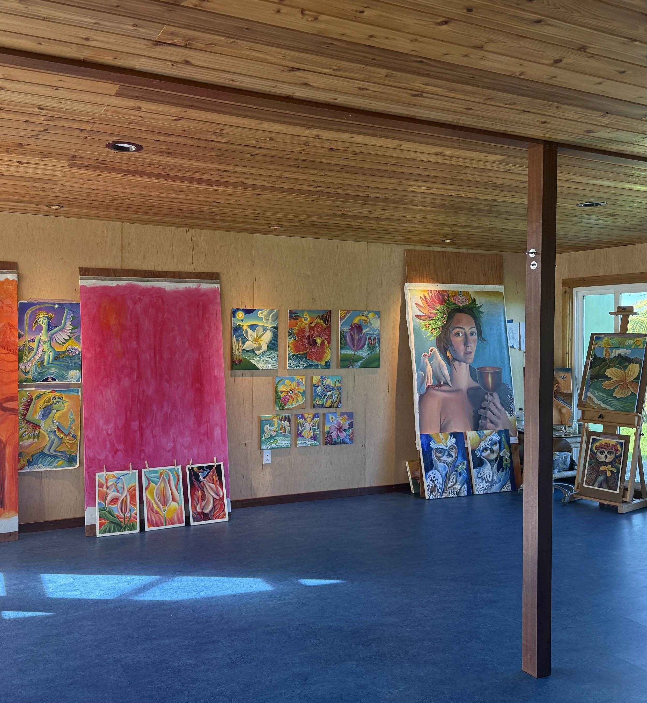 zoe rose art studio with flower paintings.JPG