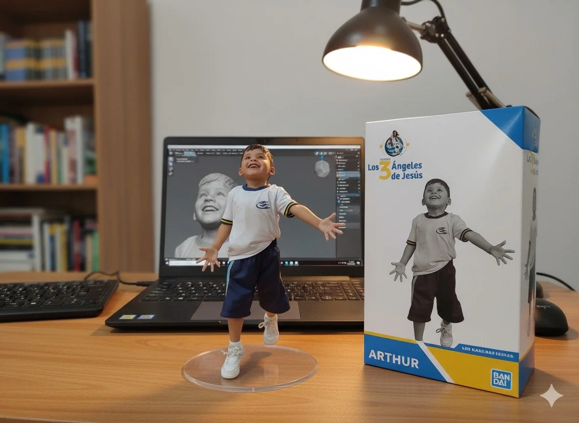 A small figurine of a smiling boy with arms outstretched, placed on a wooden desk in front of a laptop, with its box to the right. The laptop screen displays a 3D rendering of the same boy figure.