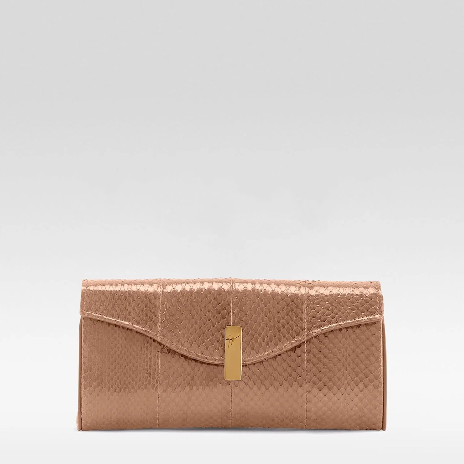 Metallic evening clutch for shipboard dining and formal nights.
Sized for essentials without returning to your suite.