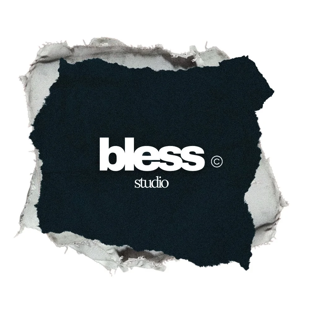 Black torn paper background with the words 'bless studio' written in white text.