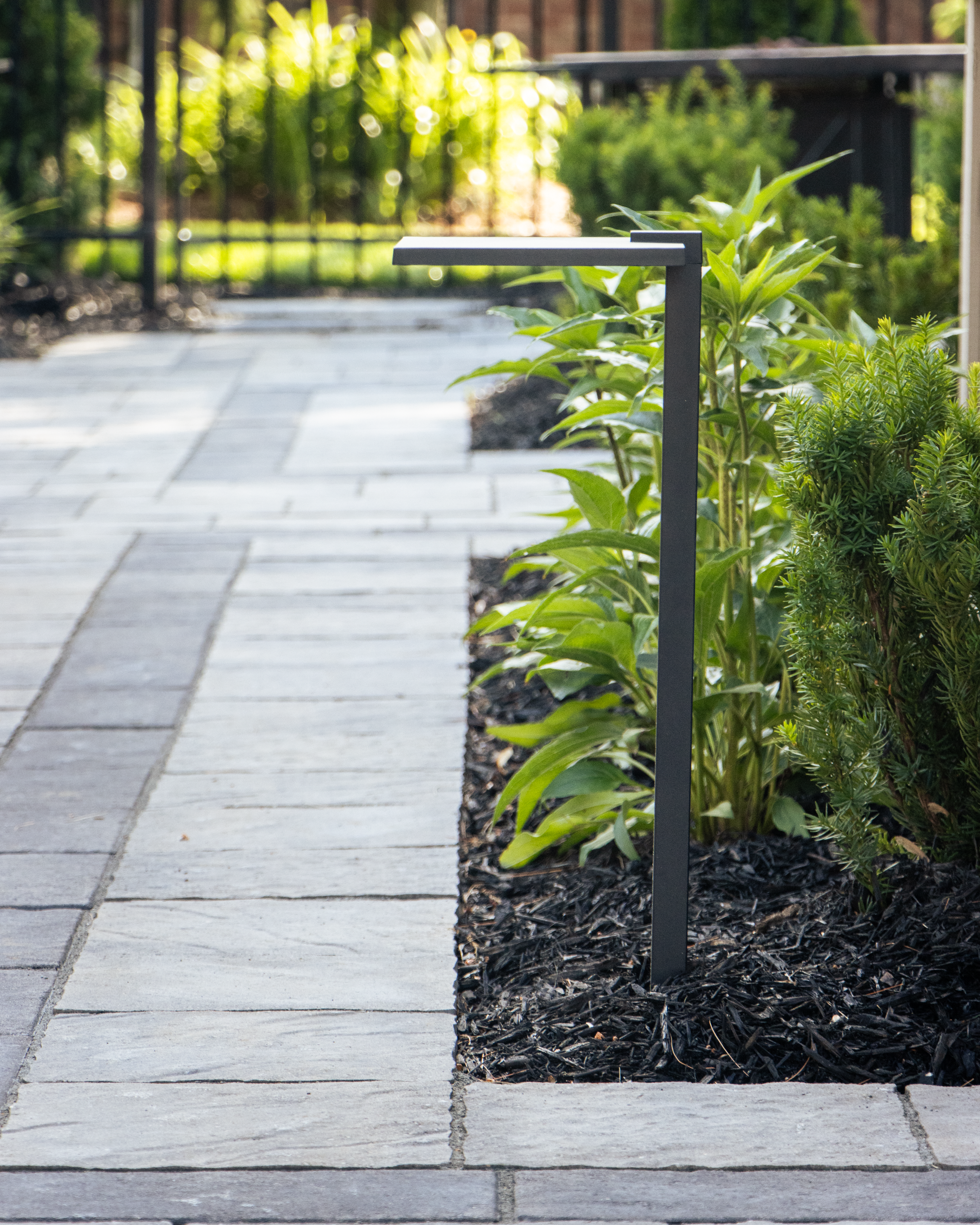 Pathway with integrated lighting and gardens