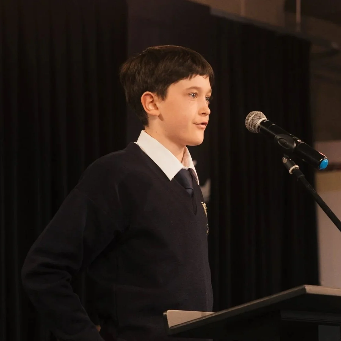 Twin Oaks Classical School student speaking at assembly