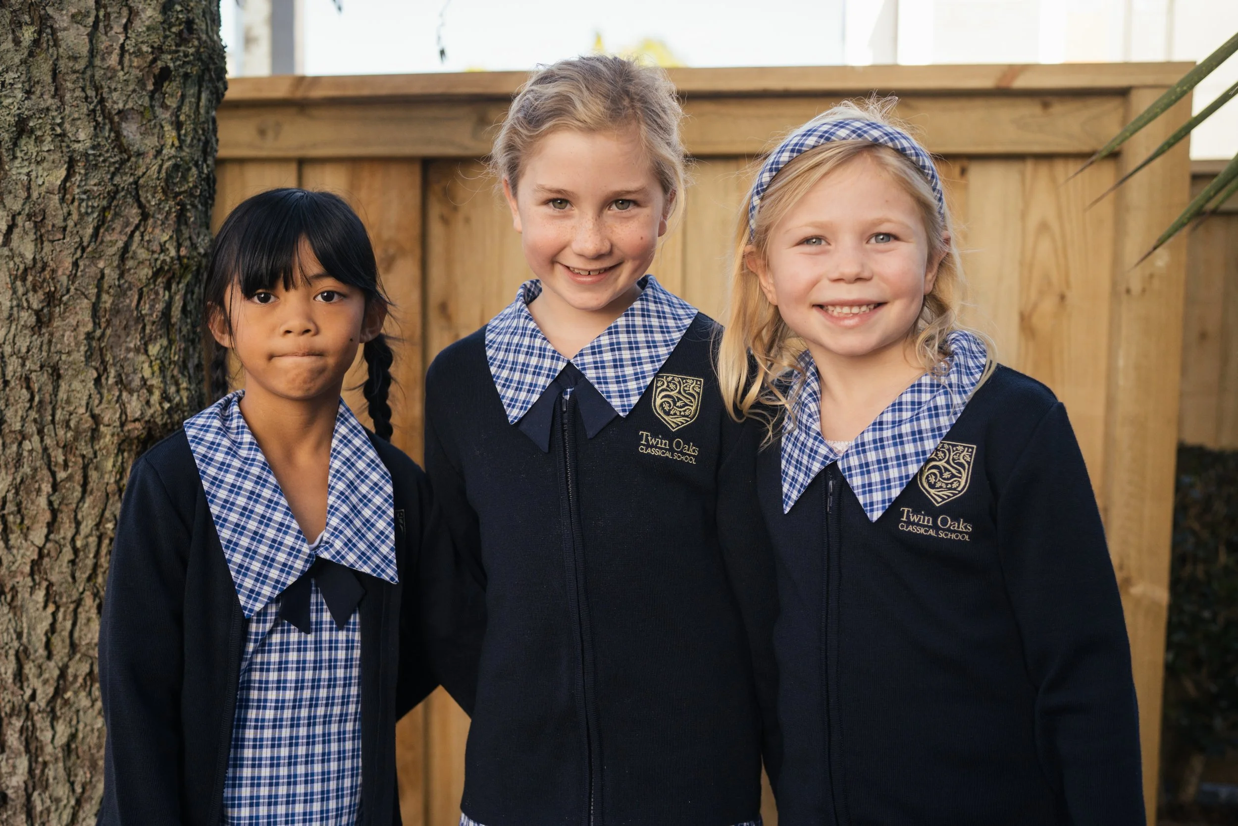 Three Twin Oaks Classical School students in Uniform
