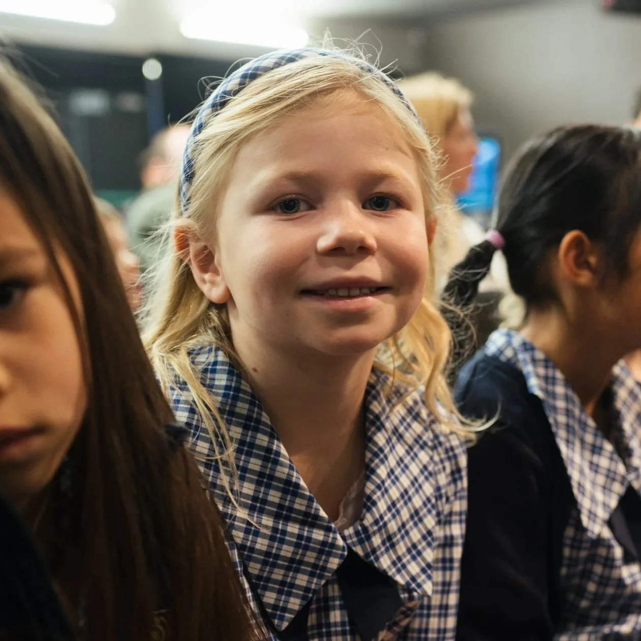 Twin Oaks Classical School student smiling at assembly