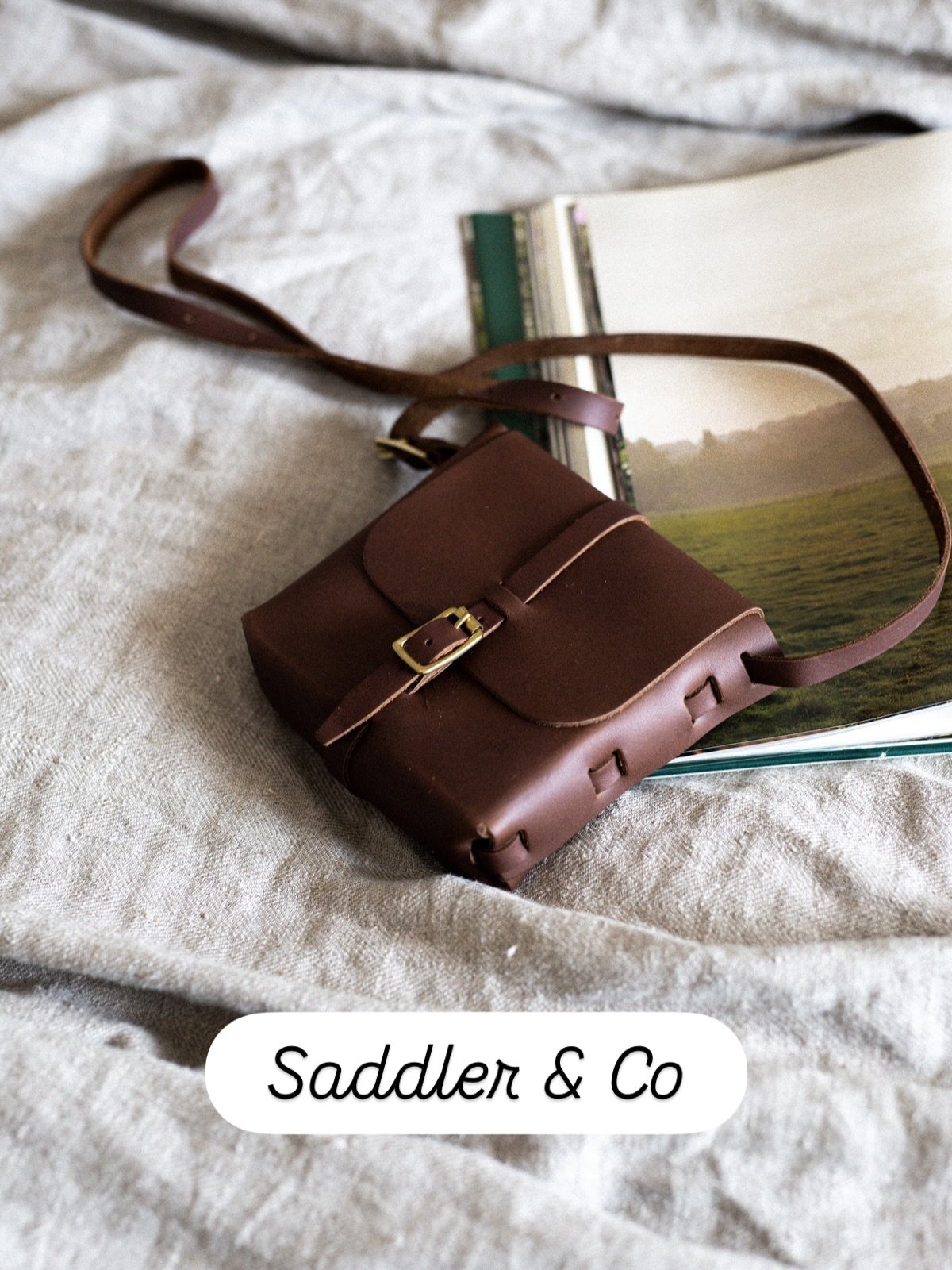 The Petite Satchel bag is a simple bag to carry by your side.

This is an essentially tactile, simple item that will carry a phone, keys, and smaller items with ease due to its boxy structure. Handcrafted from our signature leather remnants, to minim