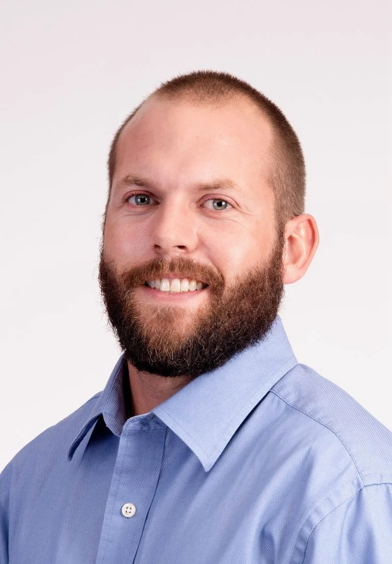 Generic user icon with a blue background.