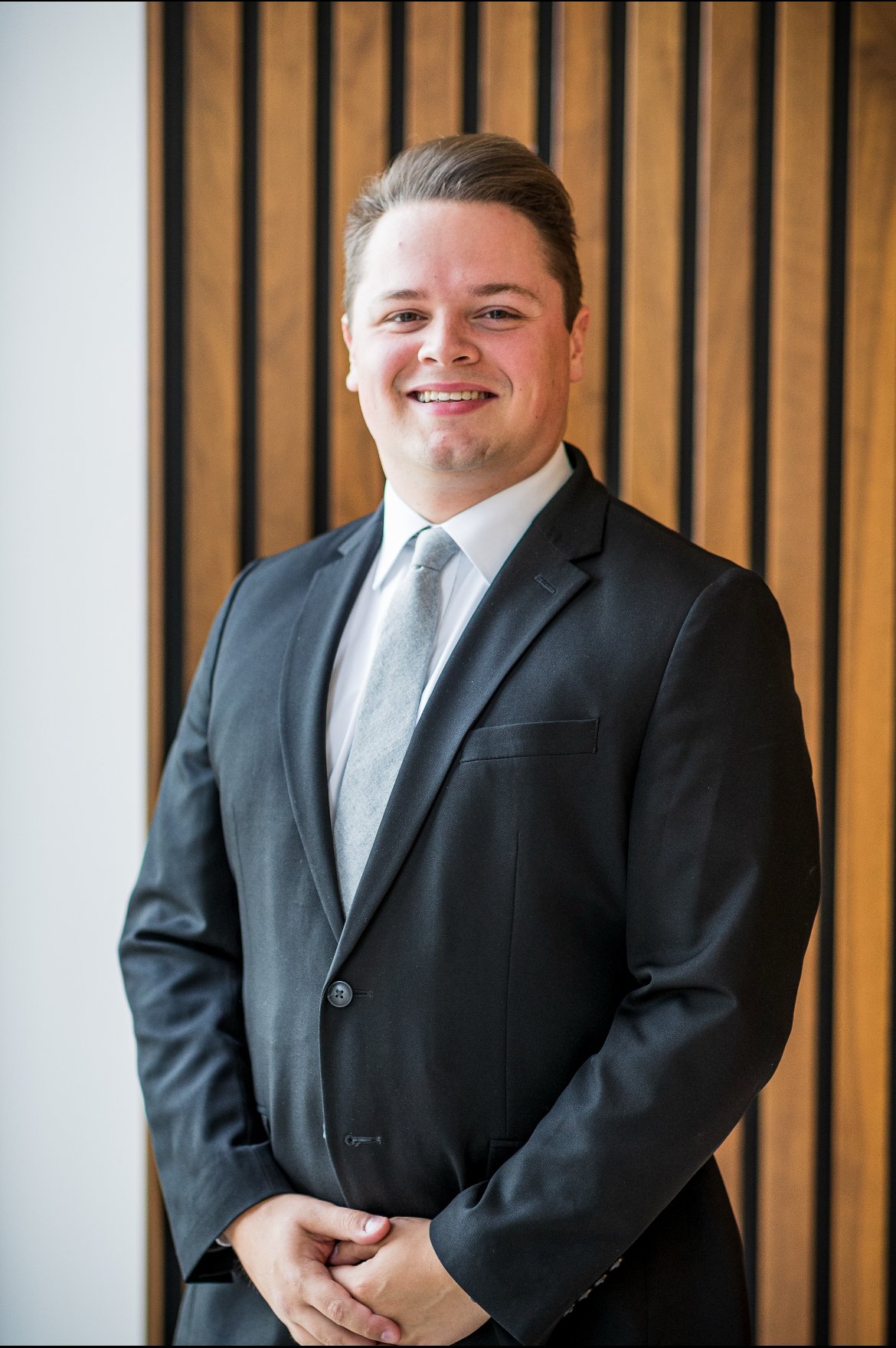 Generic user avatar with a blue background and a white silhouette of a person without facial features.