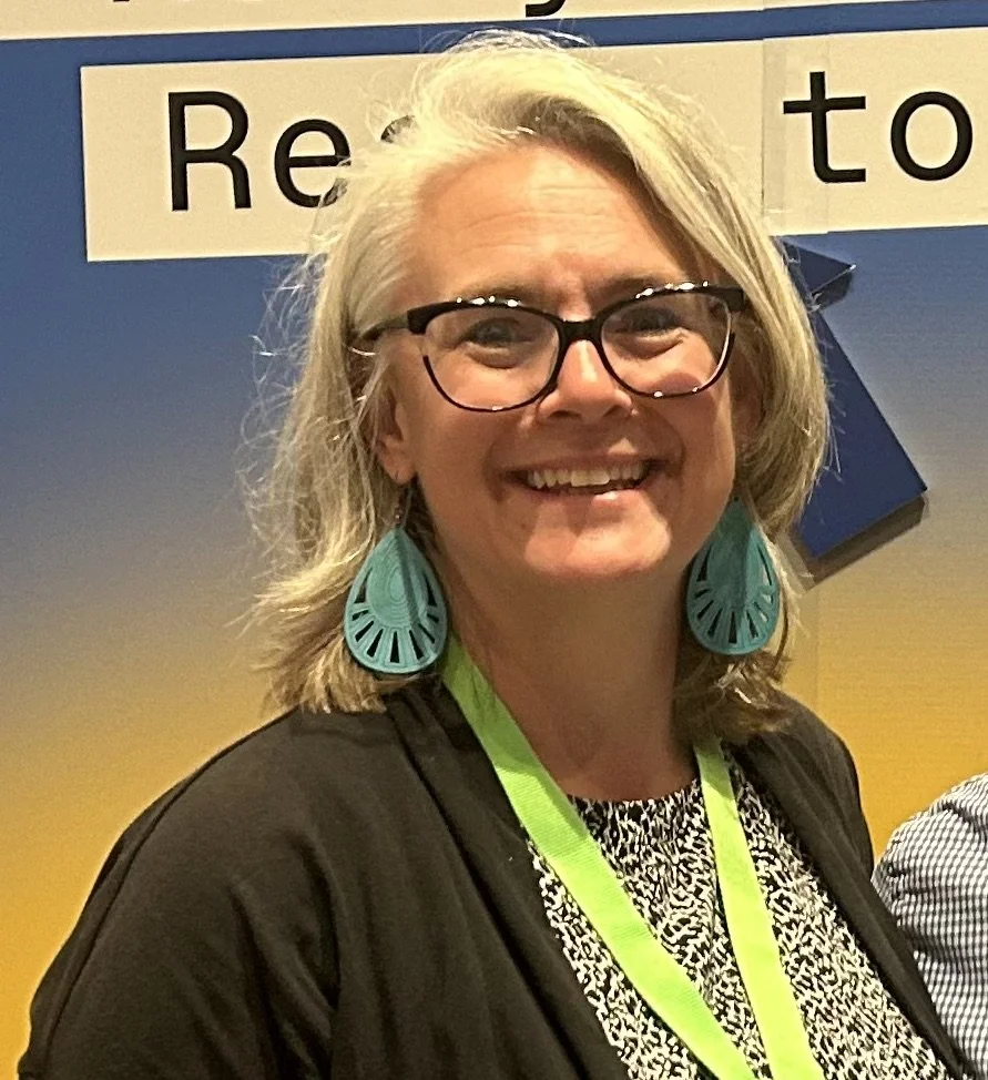 Generic user avatar silhouette with a blue background.