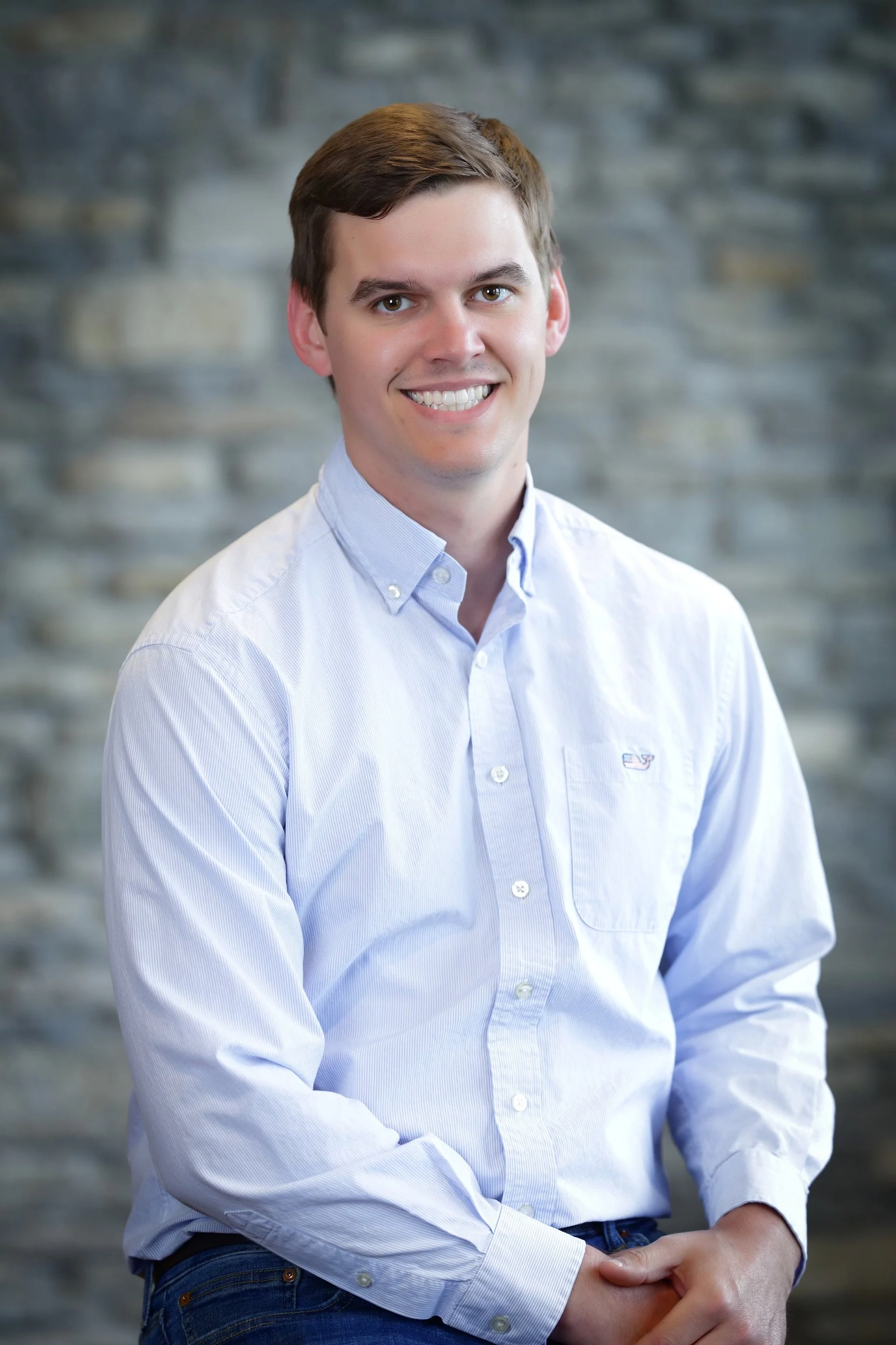 A generic user profile icon with a white silhouette of a person against a light blue background.