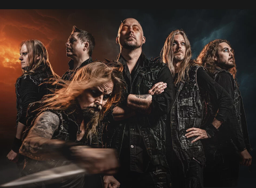 A group of six band members posing with serious expressions against a dark background with orange and blue lighting.