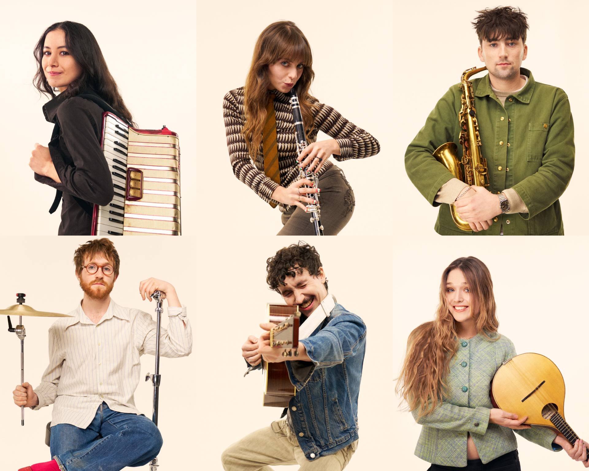 An image of Black Country, New Road, or BCNR, a group of six diverse young adults with musical instruments, posing against a plain background, smiling and looking playfully at the camera.