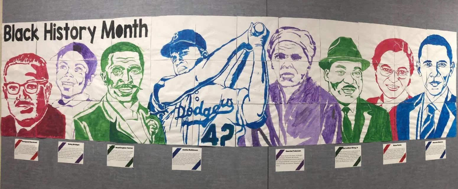Black History Month mural painted in multiple colors by students at Mayflower Mill Elementary School