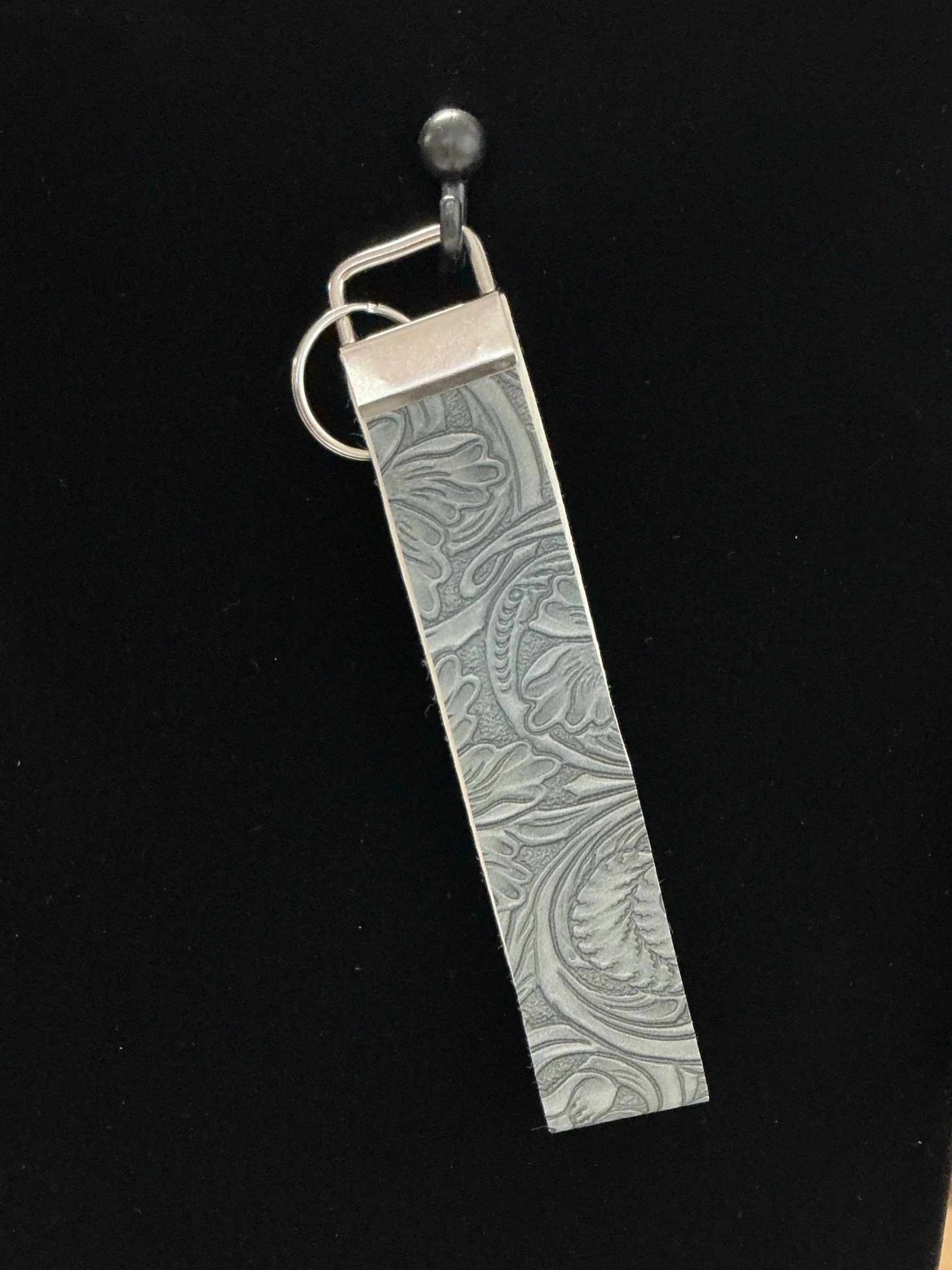 Gray feather wristlet