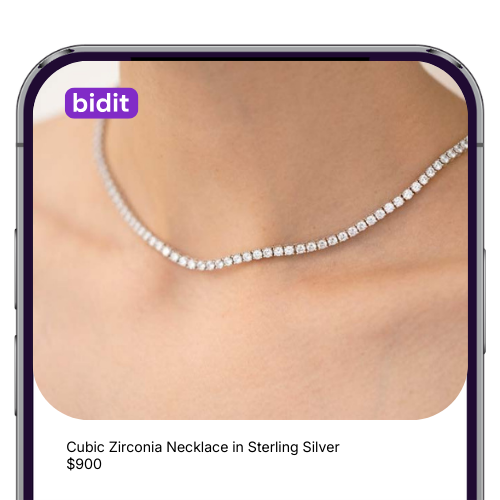 Close-up of a person wearing a cubic zirconia necklace in sterling silver, with a caption indicating the price as $900.