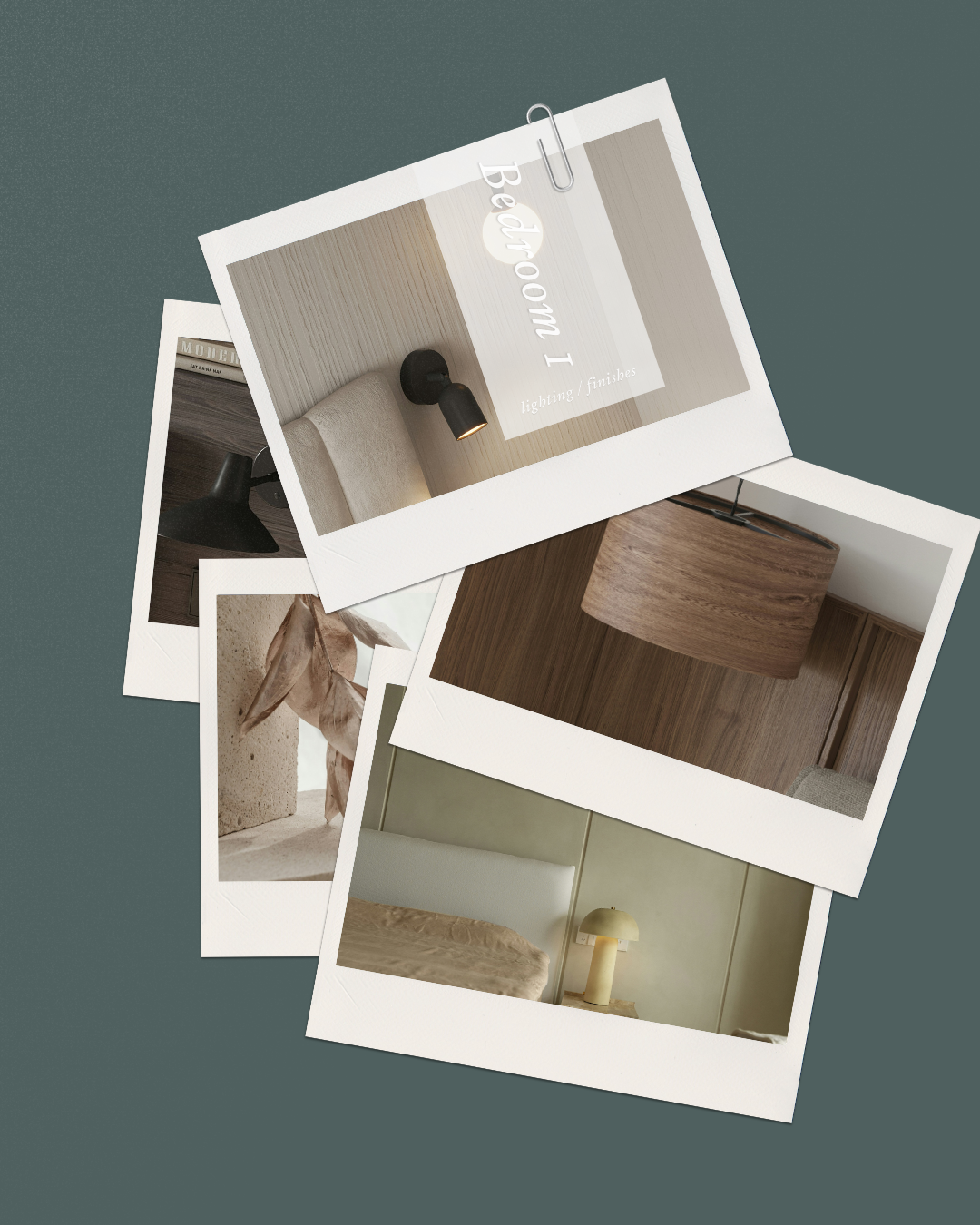 A white vase with two dried flowers on a black round table beside a beige and black striped pillow.