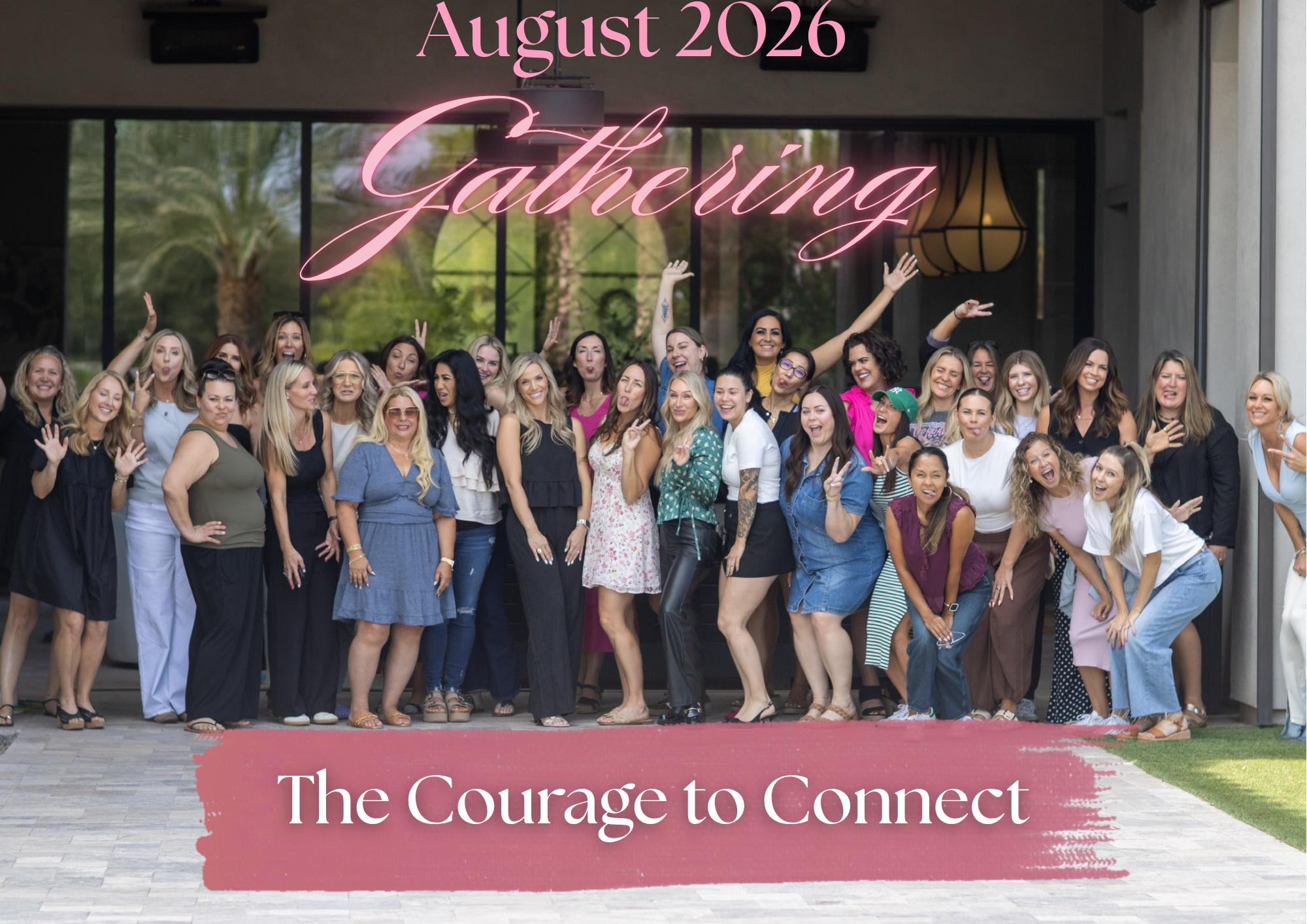 Group of women posing at an event titled "Gathering" with the date August 2026, outdoors in front of a building with large glass windows and trees reflected in the background, some women making playful faces and gestures.