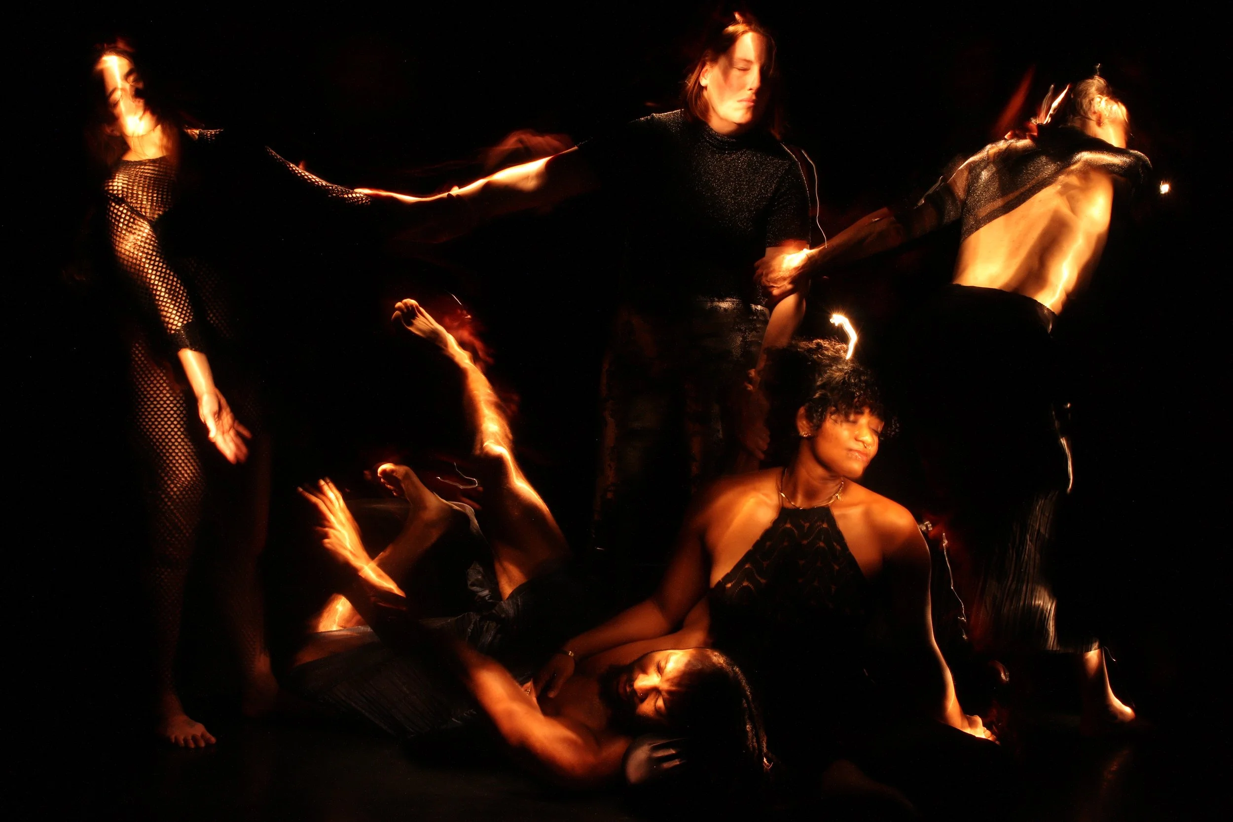 Pieta, a light painting by Gerald Pirner. Five dancers are connected on different levels against a black background.